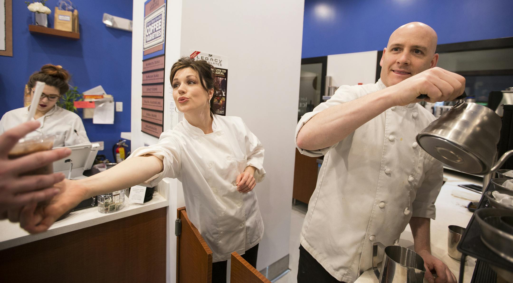 Lorraine and Mark Dixon serve coffee at their shop Legacy Chocolates in the skyway level of the Pioneer building in downtown St. Paul. ] (Leila Navidi/Star Tribune) leila.navidi@startribune.com BACKGROUND INFORMATION: Monday, March 14, 2016 in downtown St. Paul. A group of building and business owners along the stretch of 4th Street in downtown St. Paul hope to change its status as a dead zone between bustling areas. On Monday they debuted a plan for what they call the 4th Street Market District