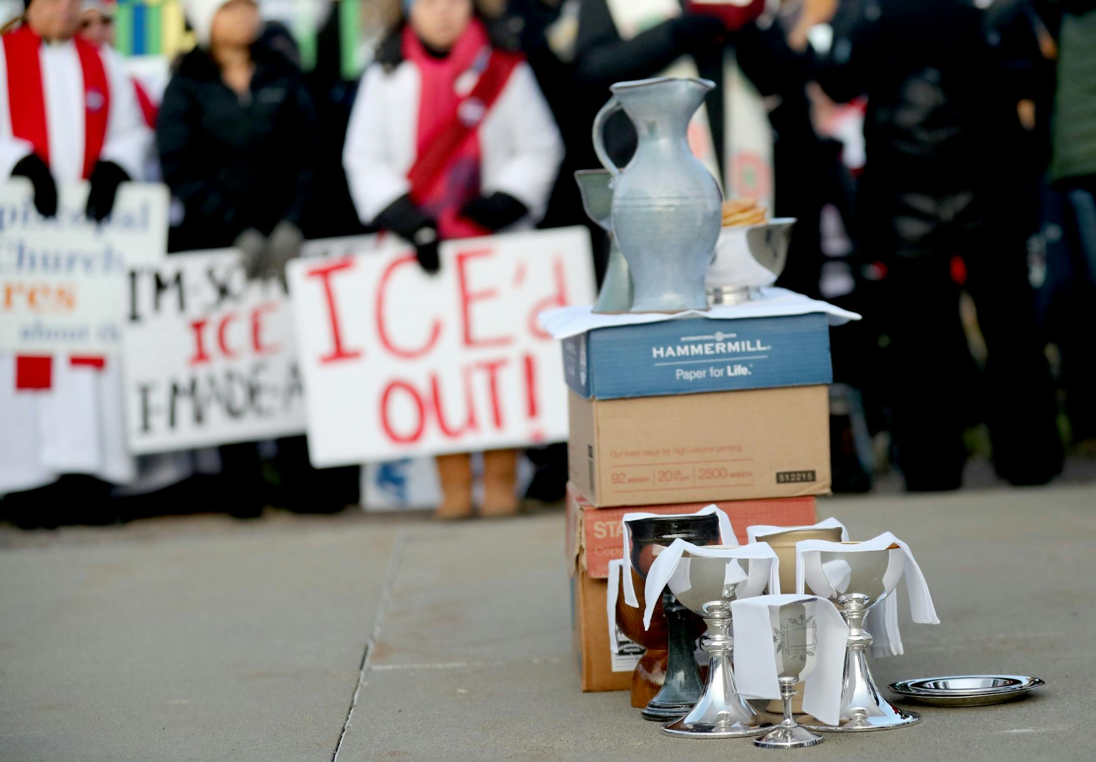 Bread and wine for a communion sits outside the Whipple Federal Building Tuesday, Oct. 29, 2019, in St. Paul, MN. Clergy and protestors gathered for a service and communion outside the Whipple Federal Building and to protest the naming of the building after the Episcopal bishop because deportations and other actions at the courthouse are in opposition to the beliefs of the Episcopal church, they stated.