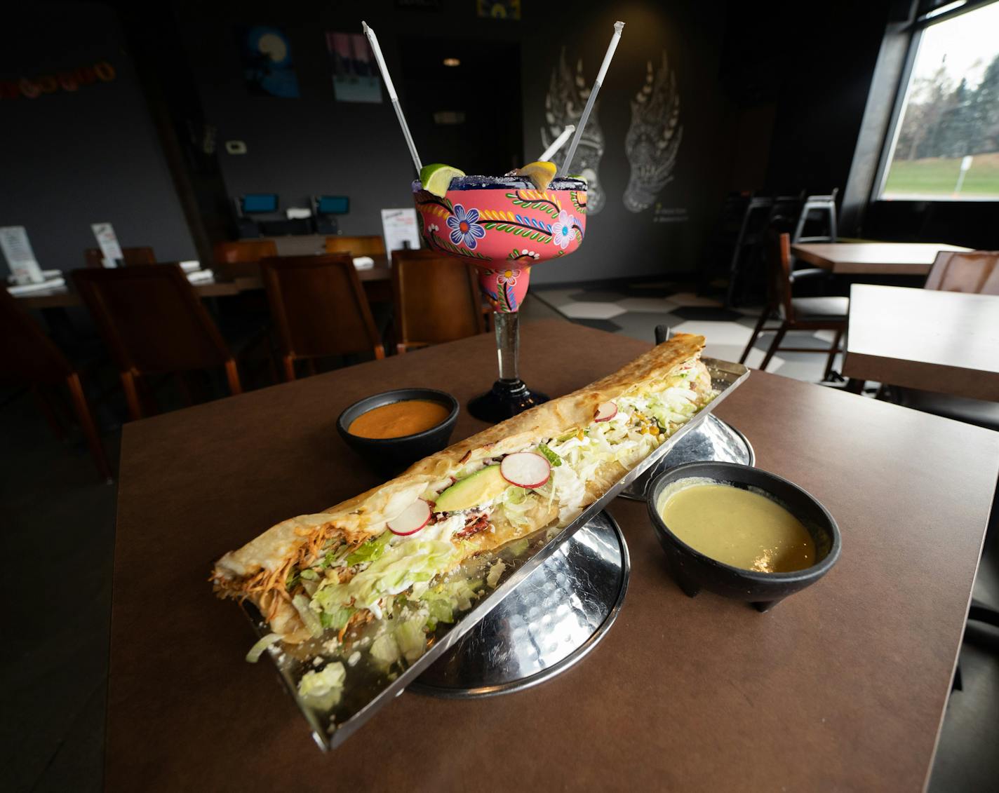 The machete quesadilla, aka the machetazo, from Machete Cocina Mexicana, is nearly two feet long and packs up to five fillings in a house-made corn tortilla.