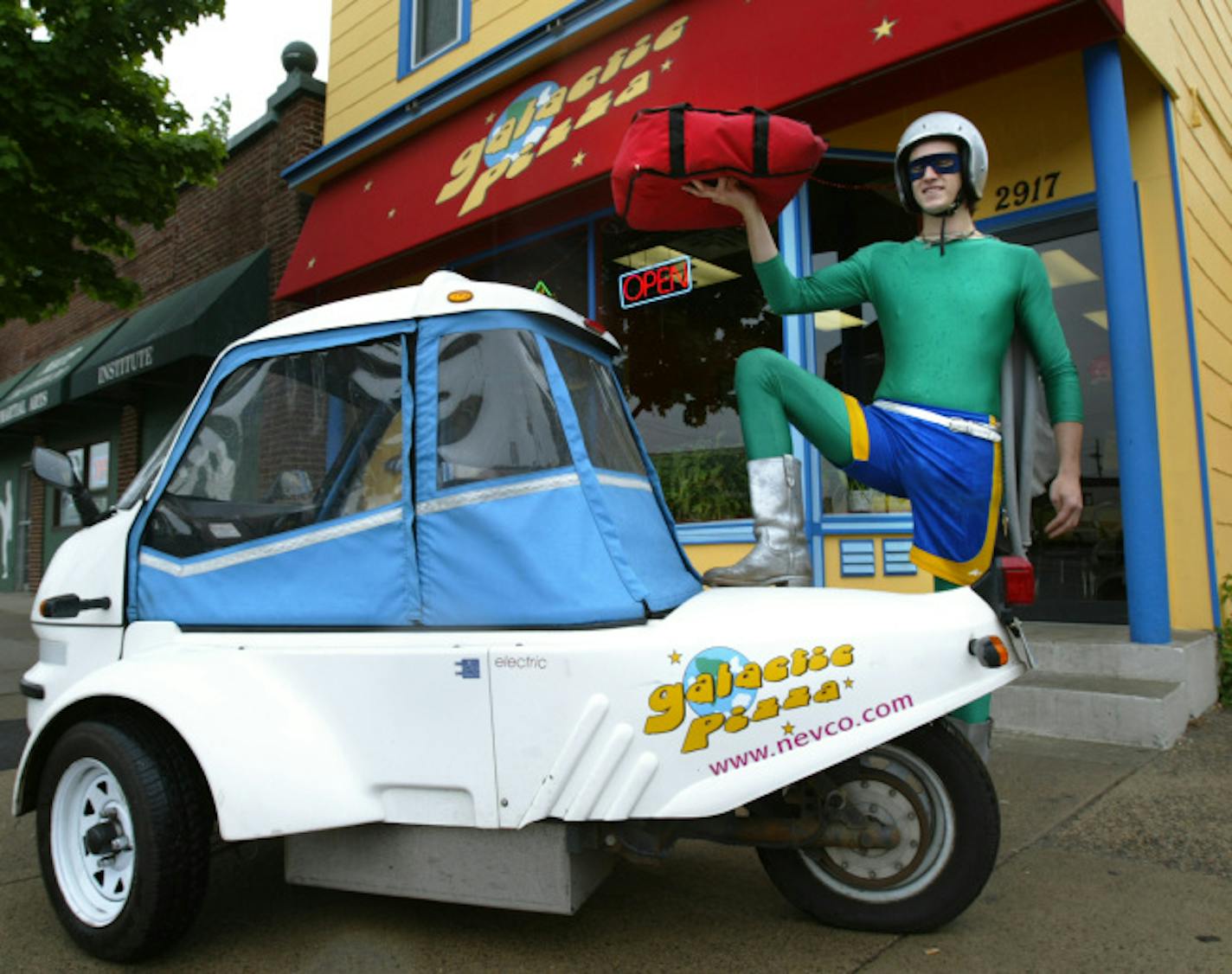 Joel koyama/Star Tribune Andrew Nasvik delivers pizza's at Galactic Pizza located on 2917 Lyndale Avenue So. in Minneapolis. Galactic Pizza is a Eco-conscious all natural pizzeria that delivers pizza's using pollution-free electric-powered Gizmo-mobiles.