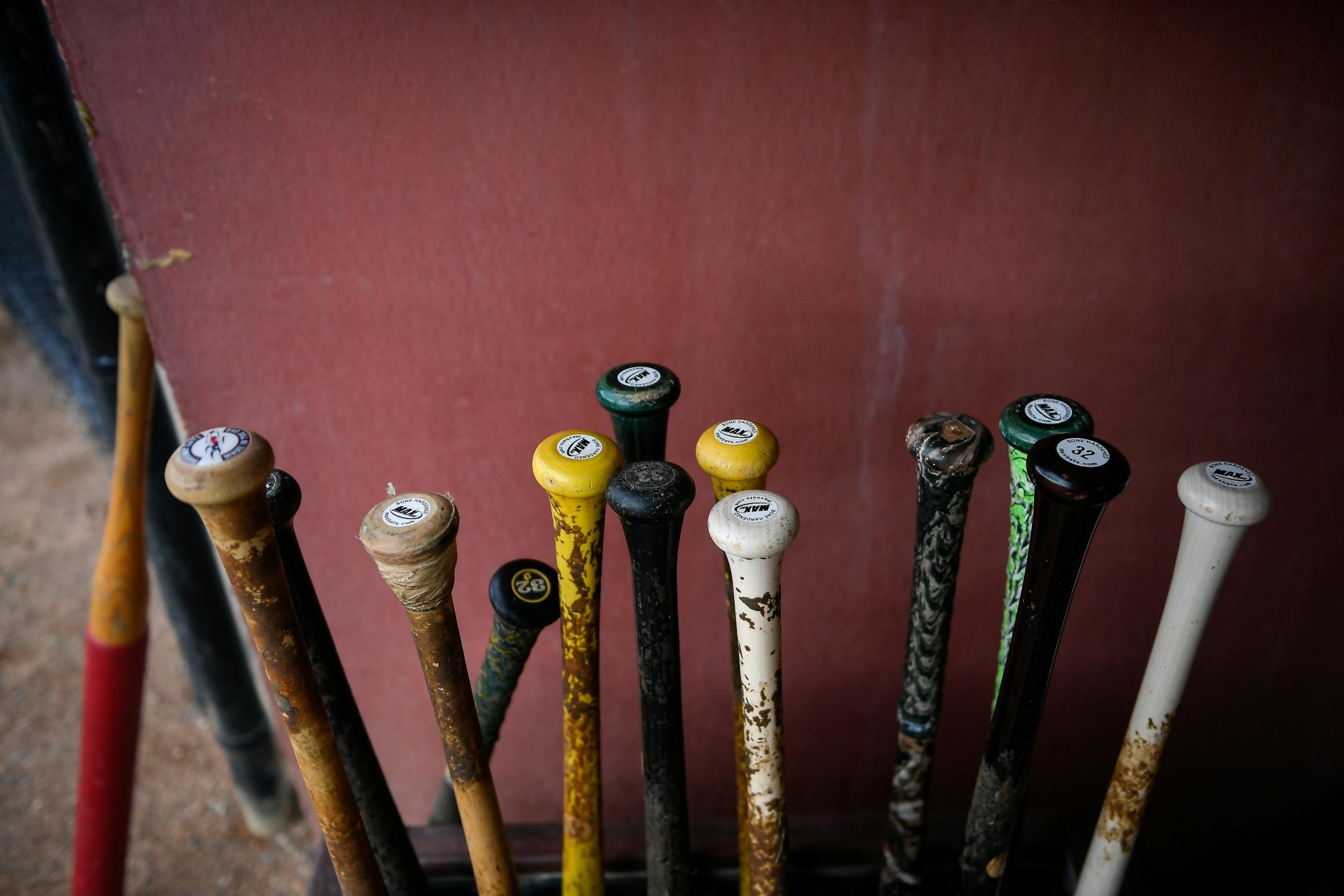 Baseball players in Stearns County's summer league use wooden bats.