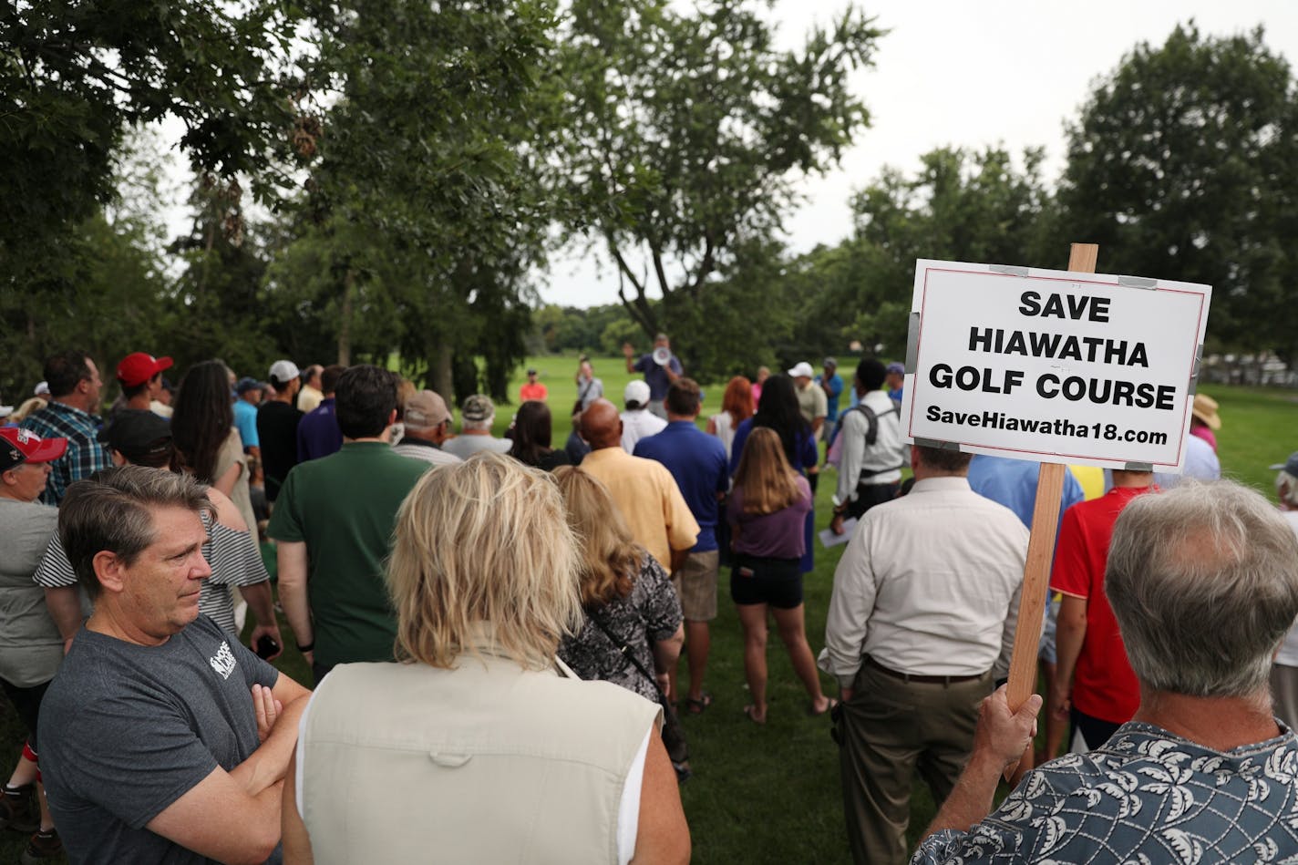 Golfers and supporters of the Hiawatha Golf Course held signs as they rallied against the Park Board's recent decision to reduce pumping and close the course at the end of 2019 season Tuesday.