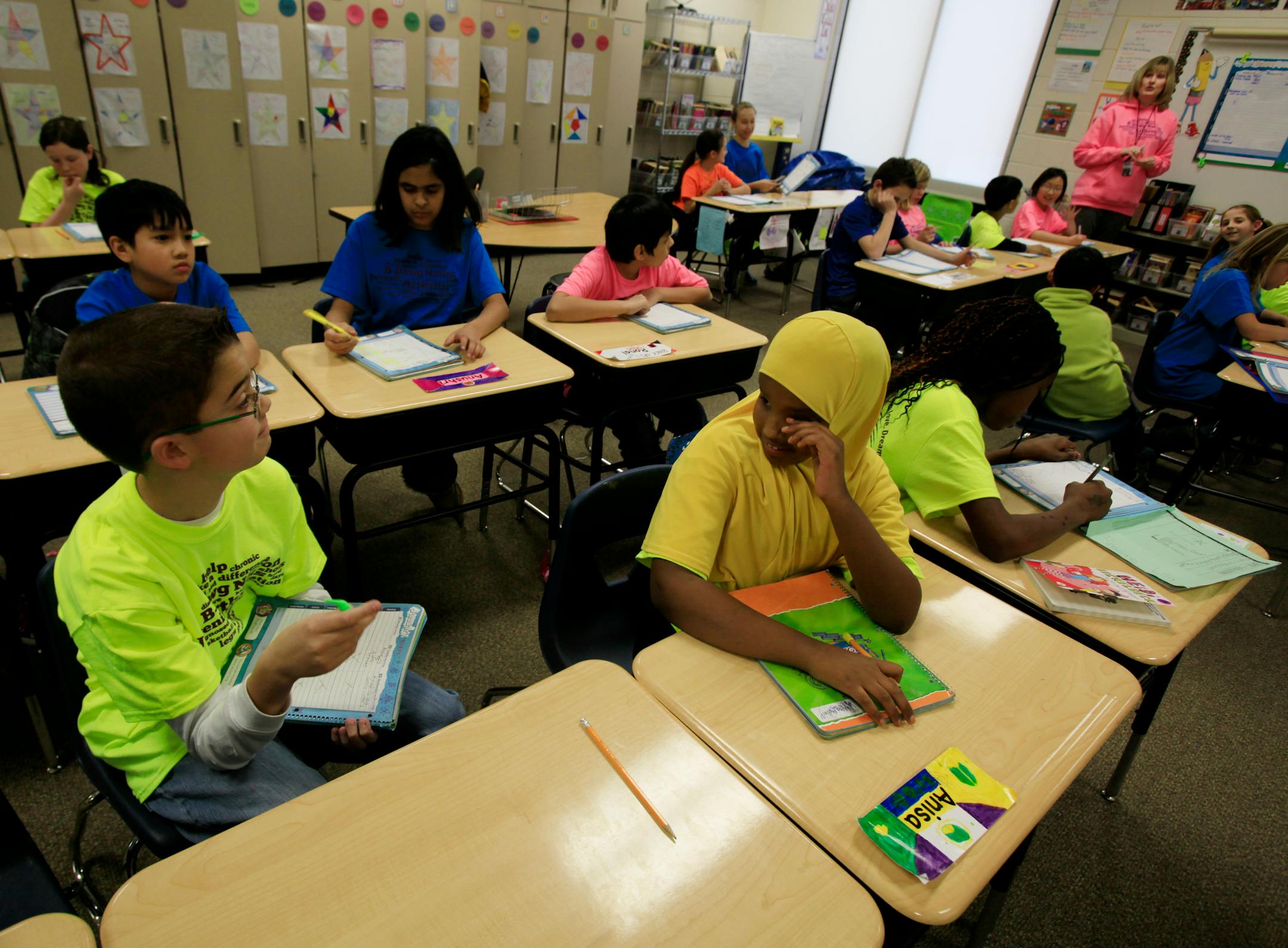 Jarrett Michie, 10, takes time to study with a couple of classmates in his 5th grade class at Diamond Path School in Apple Valley, MN on January 23, 2013.