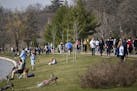 Hundreds of pedestrians and cyclists spent the afternoon at Bde Maka Ska Wednesday. ] aaron.lavinsky@startribune.com Minneapolis' parks have become a 