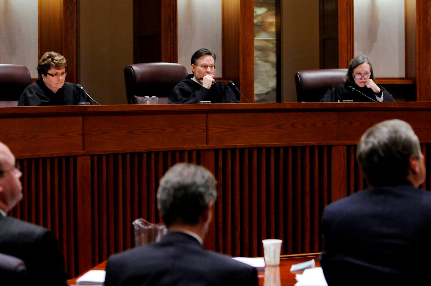 A three-judge panel including, from left, Elizabeth Hayden of Stearns County, Kurt Marben of Pennington County and Denise Reilly of Hennepin County listened to arguments in the Senate recount trial.