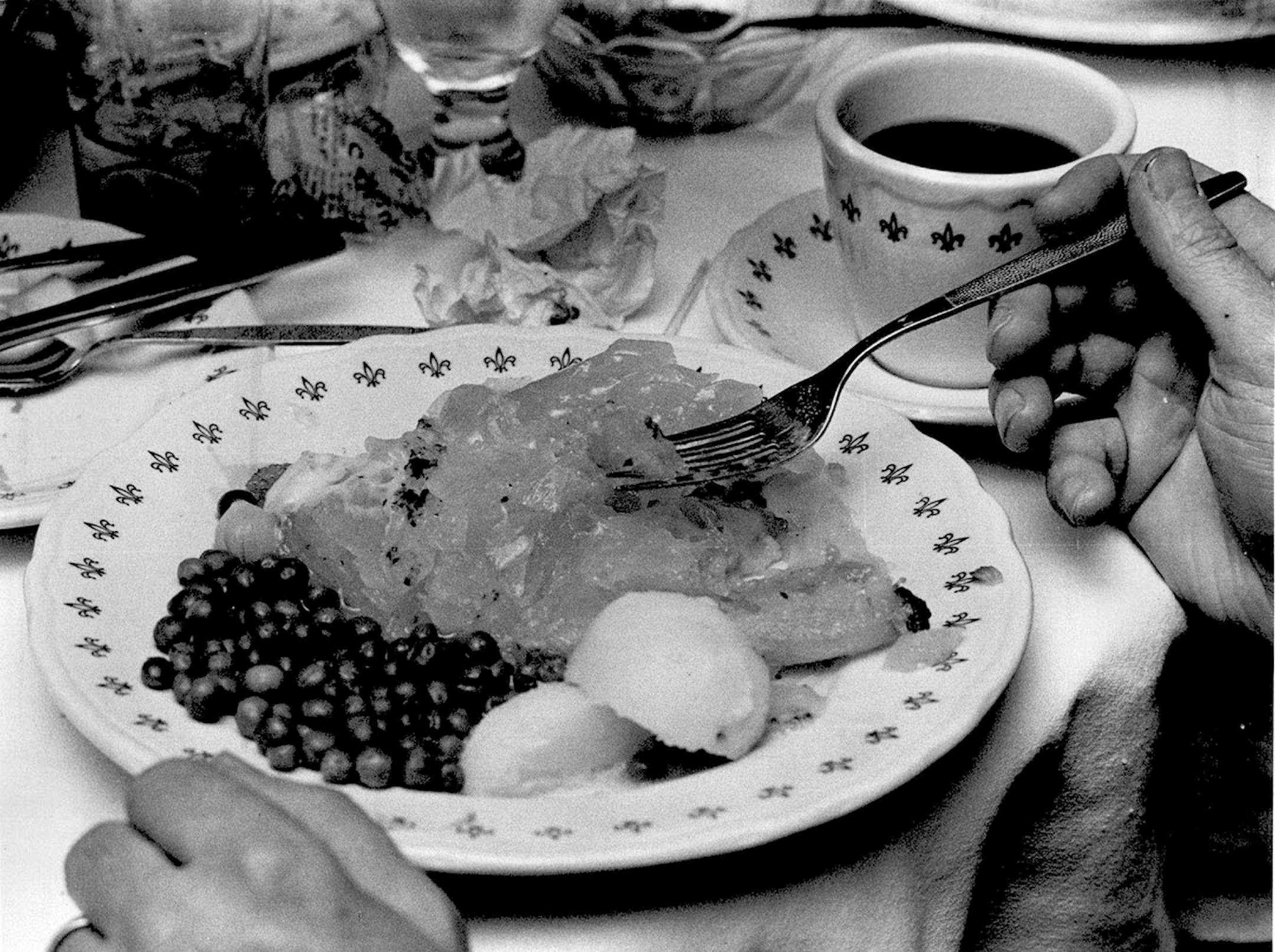 December 4, 1980 NW Bell lutefisk club -- Norsk heaven is a plate of lutefisk, peas, boiled potatoes. Art Hager, Minneapolis Star Tribune