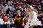 Gophers guard Mike Mitchell Jr. makes a pass against Indiana center Kel'el Ware during Minnesota's 74-62 road loss on Jan. 12.