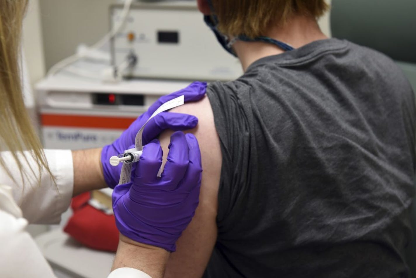 This May 4, 2020, photo shows the first patient enrolled in Pfizer's COVID-19 coronavirus vaccine clinical trial at the University of Maryland School of Medicine in Baltimore.