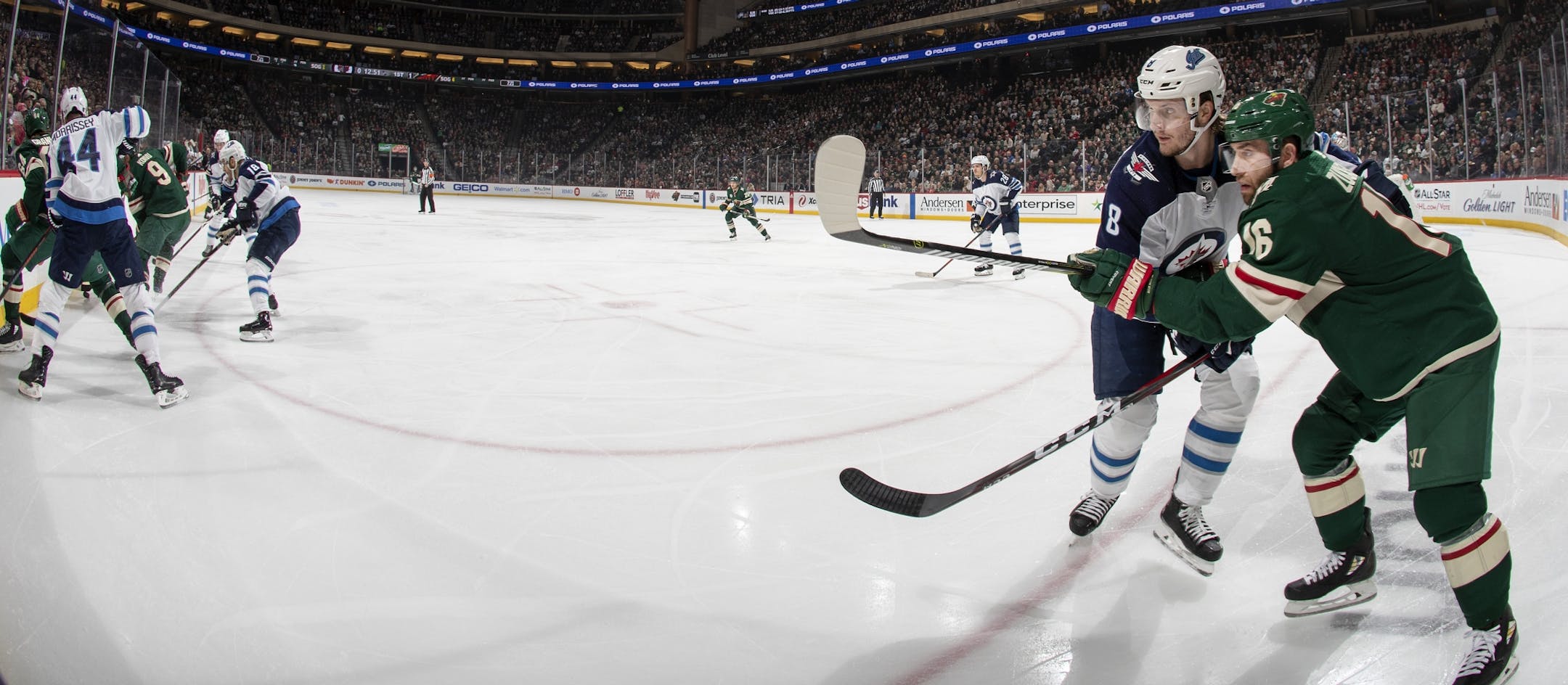 Jacob Trouba (8) and Jason Zucker (16) fought for position in the first period.