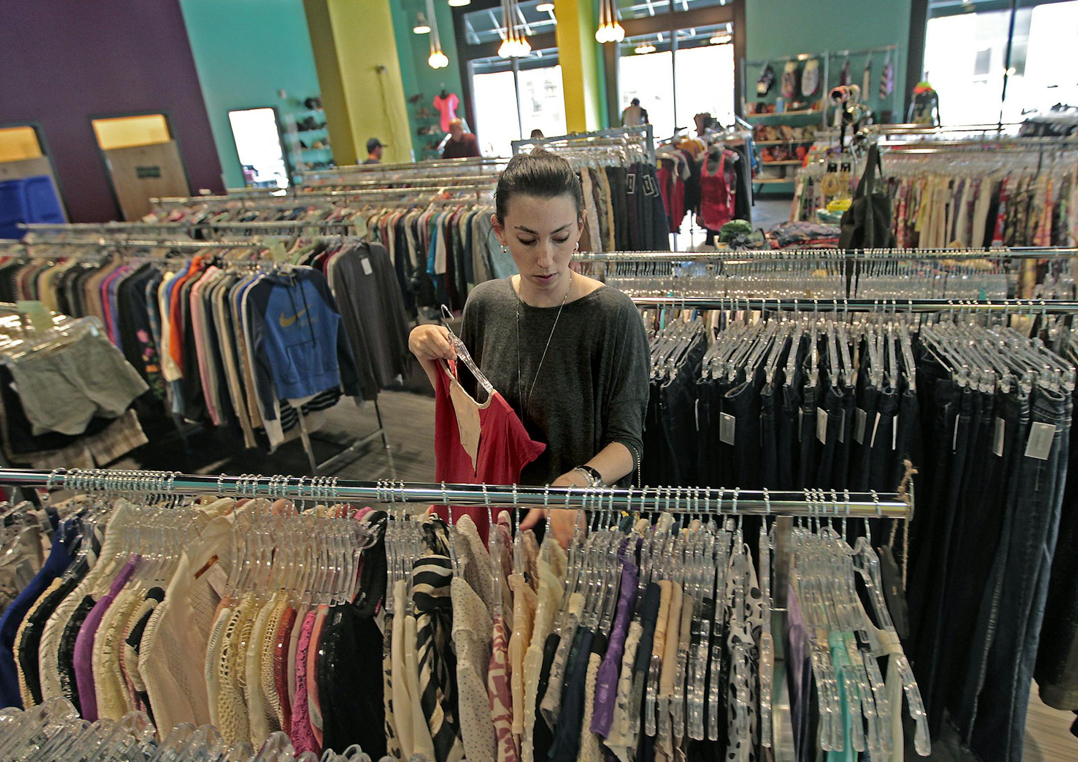Gina + Will's General Manager Danielle Stager prepared clothing in preparation for the grand opening at the new Goodwill store near the University, Wednesday, August 20, 2014 in Minneapolis, MN. ] (ELIZABETH FLORES/STAR TRIBUNE) ELIZABETH FLORES • eflores@startribune.com