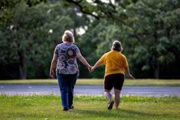 Maddie Brennan, right, shown in June with her mother, was a resident of a Bridges MN group home who left because of the uncertainty about the organiza