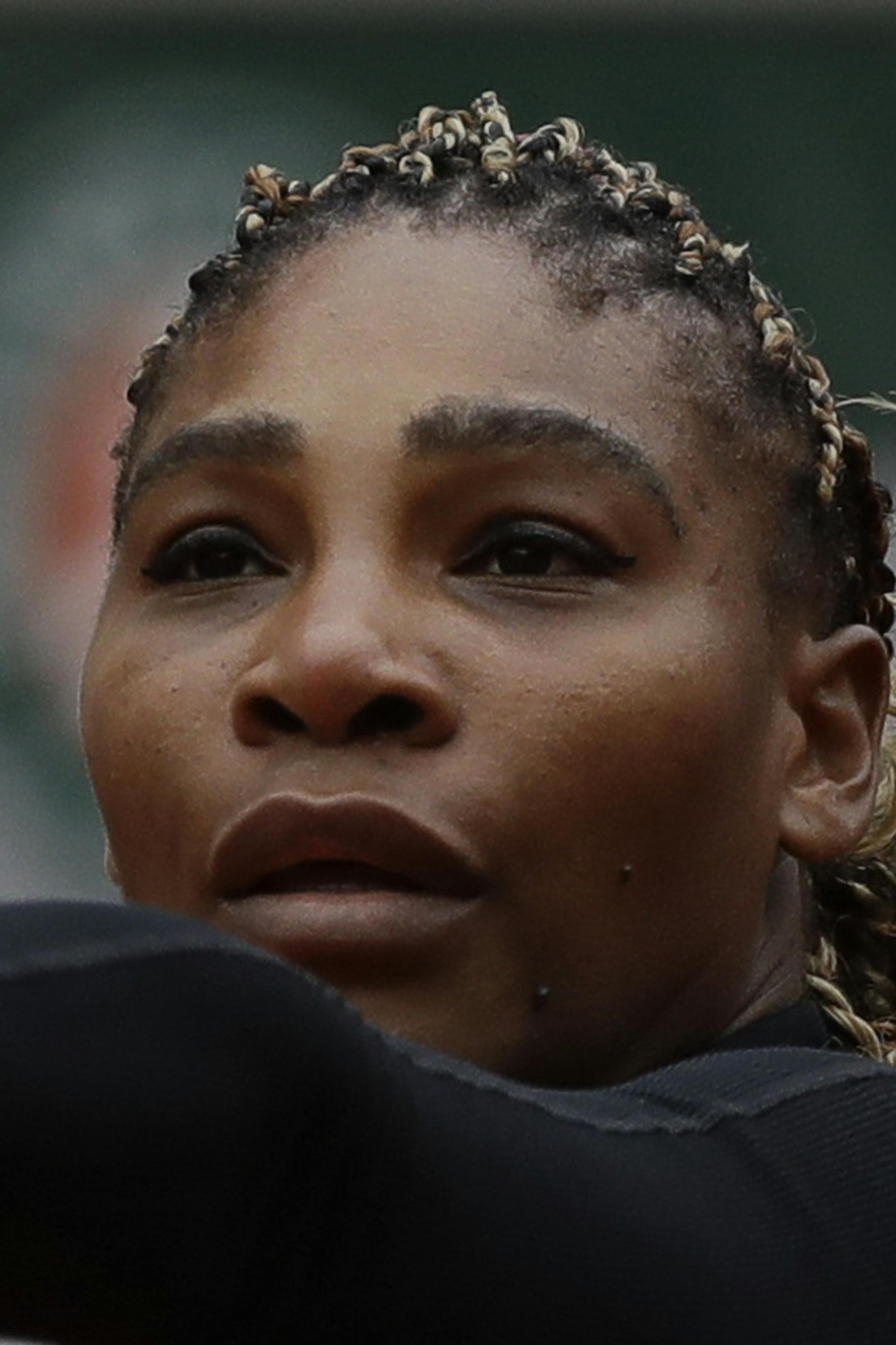 Serena Williams of the U.S. serves against Kristie Ahn of the U.S. in the first round match of the French Open tennis tournament at the Roland Garros stadium in Paris, France, Monday, Sept. 28, 2020. (AP Photo/Alessandra Tarantino)