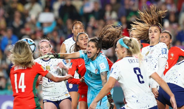 Portugal goalkeeper Ines Pereira, centre, punches the ball clear during the match against the United States.