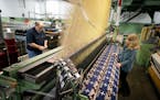 Joyce Raesner, vice president of production worked with with Doug Rammey on the weaving floor at Faribault Woolen Mill on Feb. 10, 2022 in Faribault, 