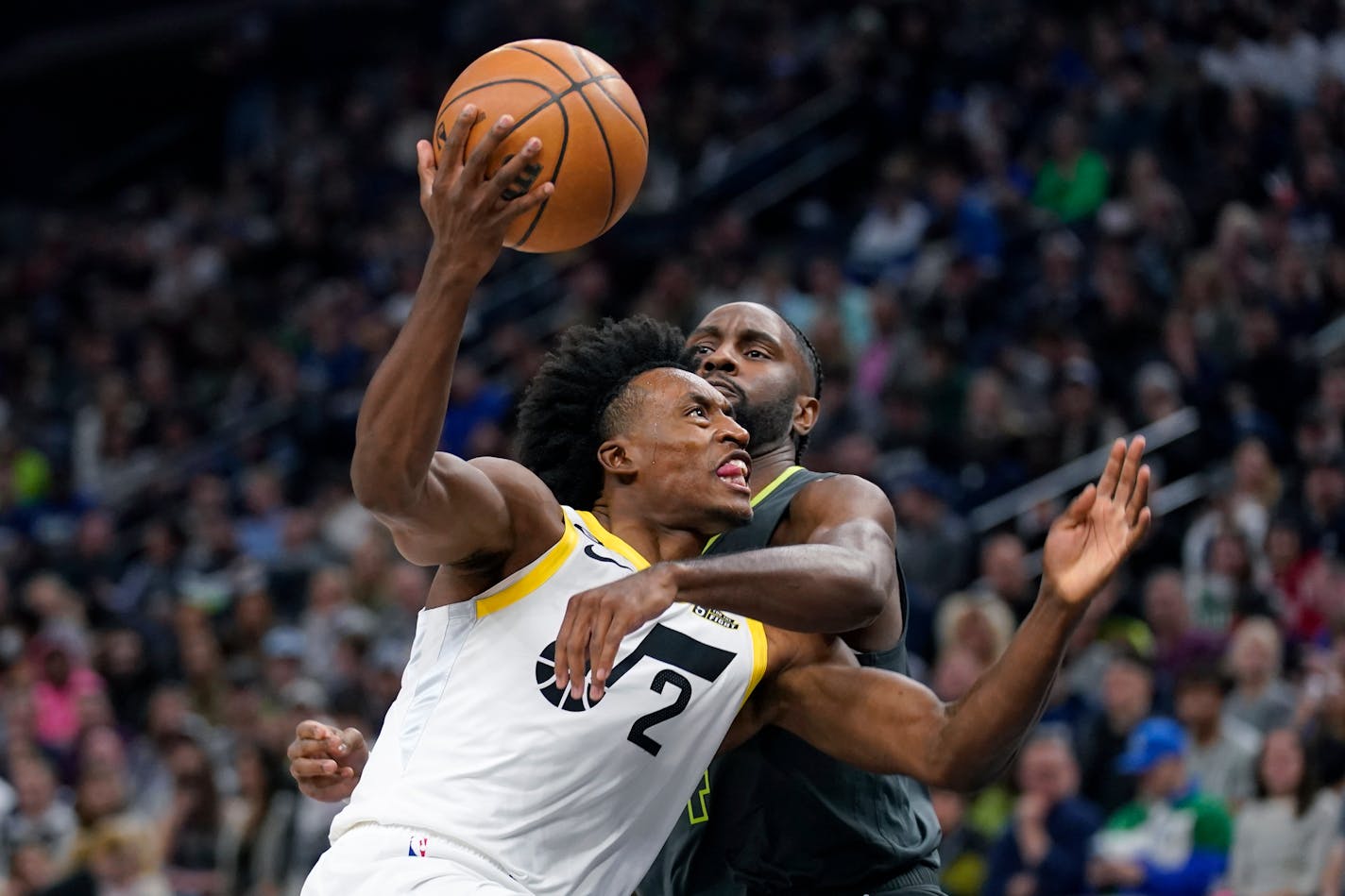 Utah Jazz guard Collin Sexton (2) is fouled by Minnesota Timberwolves guard Jaylen Nowell during the first half of an NBA basketball game Friday, Oct. 21, 2022, in Minneapolis. (AP Photo/Abbie Parr)