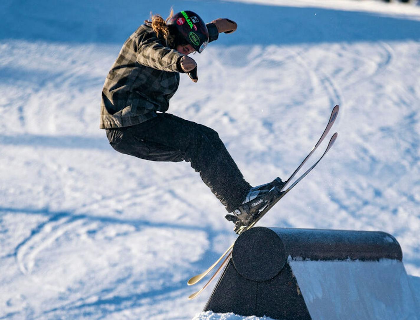 A skier jumped up on an obstacle in the Spirit Mountain terrain park.