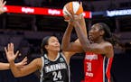 Washington Mystics center Tina Charles (31) drives to the basket around Minnesota Lynx forward Napheesa Collier (24) in the third quarter of a WNBA ba