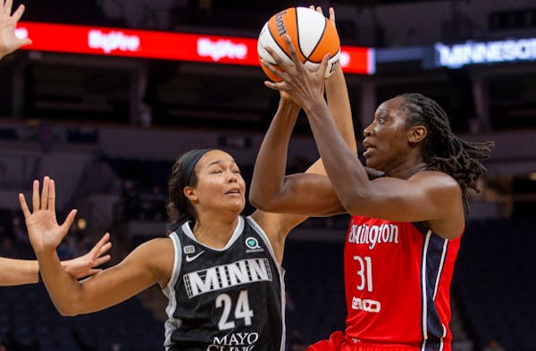 Washington Mystics center Tina Charles (31) drives to the basket around Minnesota Lynx forward Napheesa Collier (24) in the third quarter of a WNBA ba