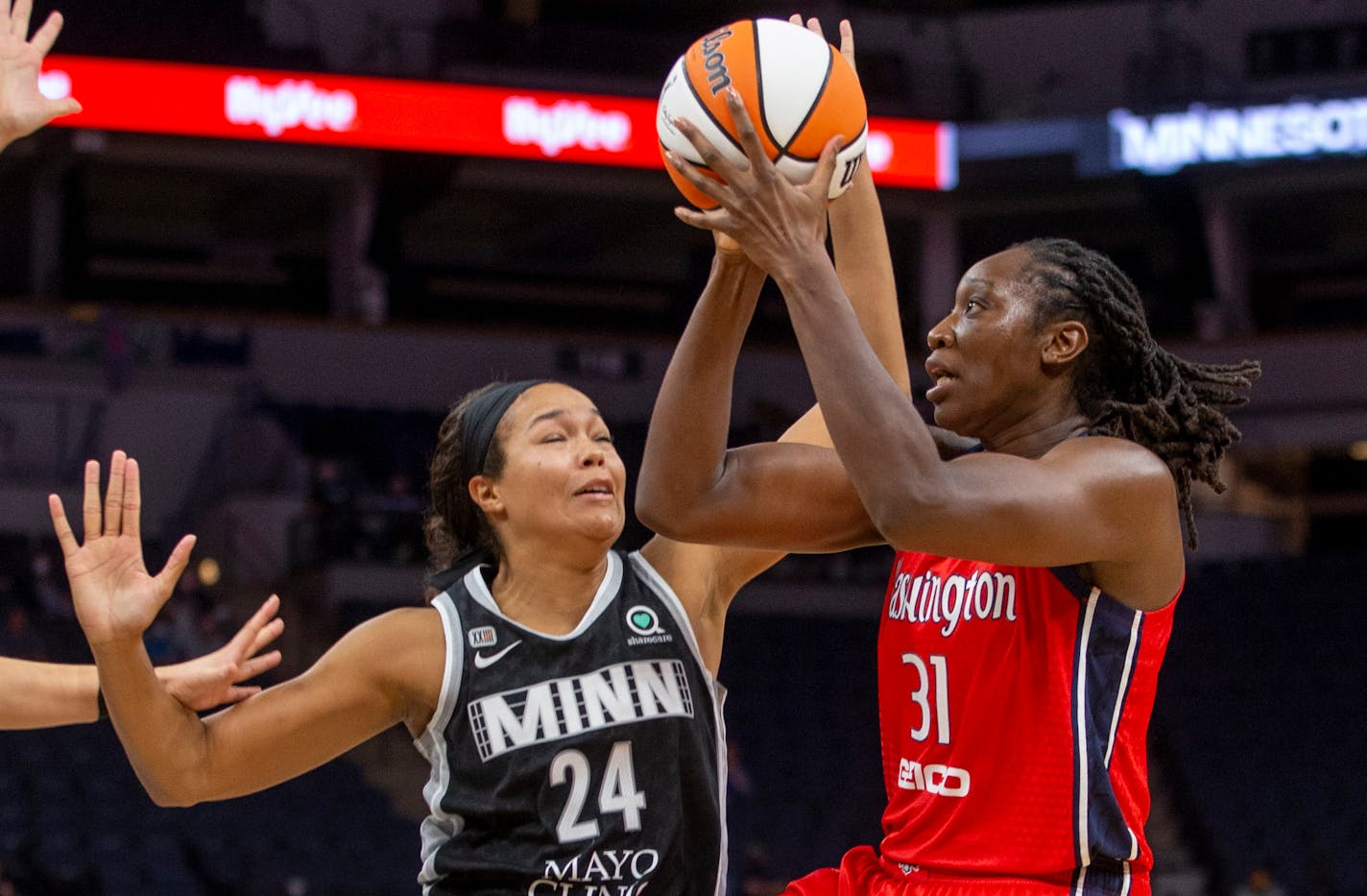 Washington Mystics center Tina Charles (31) drives to the basket around Minnesota Lynx forward Napheesa Collier (24) in the third quarter of a WNBA basketball game Saturday, Sept. 4, 2021, in Minneapolis. The Lynx won 93-75. (AP Photo/Bruce Kluckhohn)