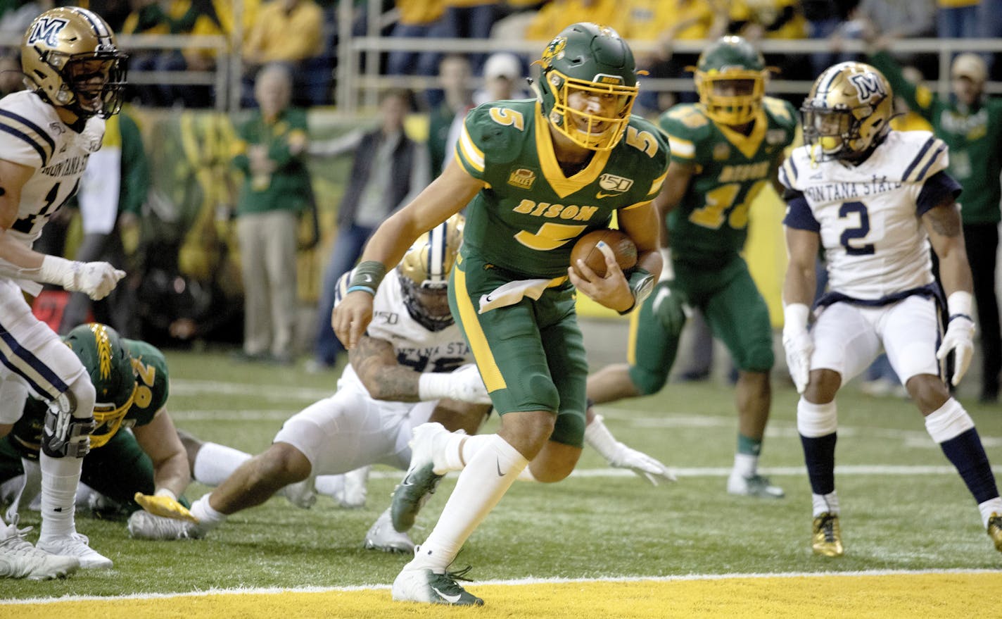 North Dakota State quarterback Trey Lance (5) scores a rushing touchdown during the first half of an FCS playoff NCAA college football game against Montana State University last month.