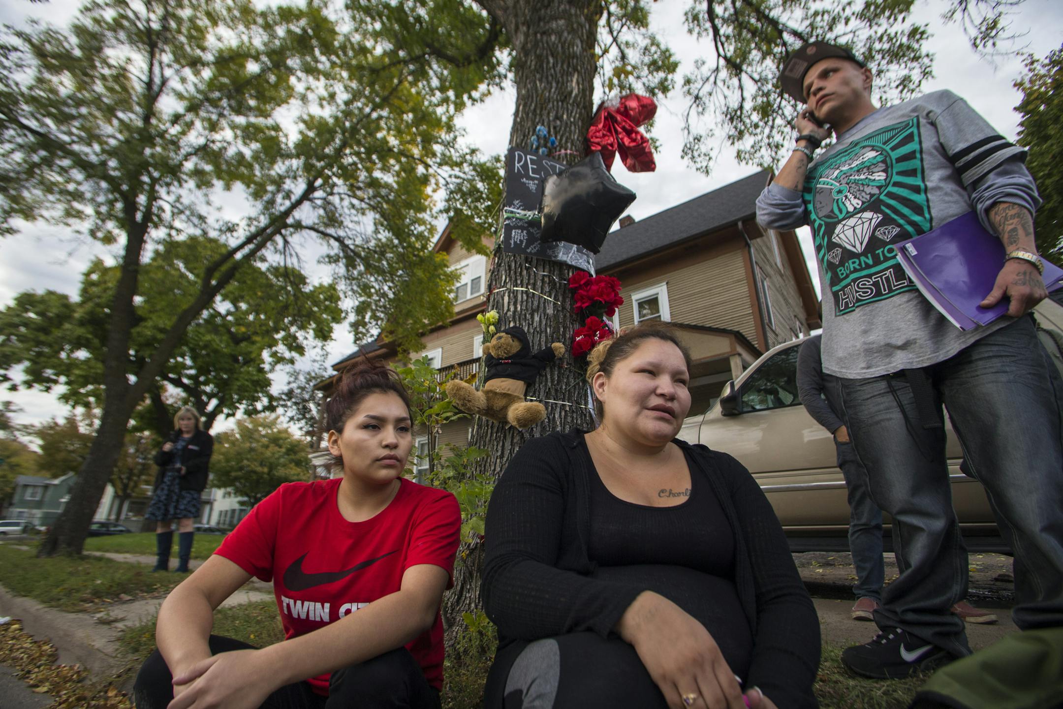 Julia Johnson, Gustav Christianson’s older sister, and her daughter Angelina Flores (left), and Christianson’s older bother Gomer Thompson sat the the memorial site waiting for more family to arrive.
