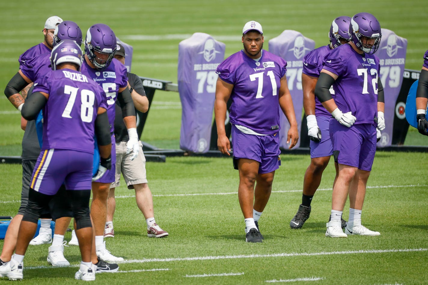 Minnesota Vikings linemen Christian Darrisaw (71) watches drills during NFL training camp Wednesday, July 28, 2021, in Eagan, Minn. (AP Photo/Bruce Kluckhohn)