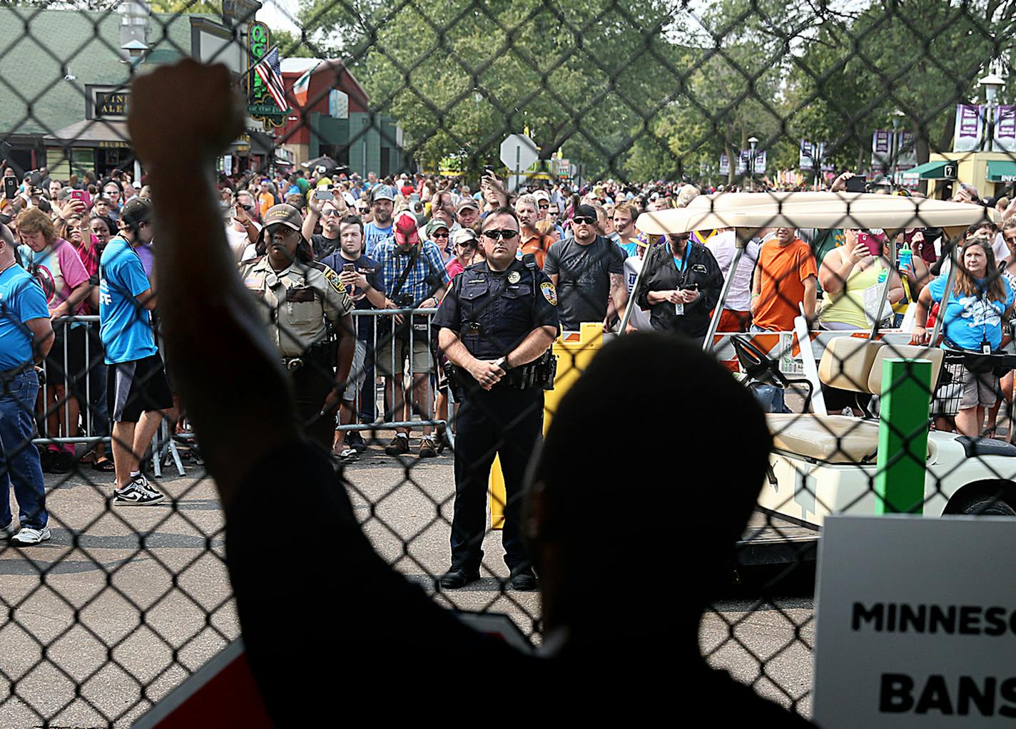 Rashad Turner, lead organizer for Black Lives Matter St. Paul, raised his arm at the front gate of the Minnesota State Fair while chanting with hundreds of other portestors. ] JIM GEHRZ &#xef; james.gehrz@startribune.com / Falcon Heights, MN / August 29, 2015 / 11:00 AM &#xf1; BACKGROUND INFORMATION: Black Lives Matter Minnesota vows to disrupt State Fair's first Saturday by assembling at Hamline Park and marching to the fairgrounds entrance.