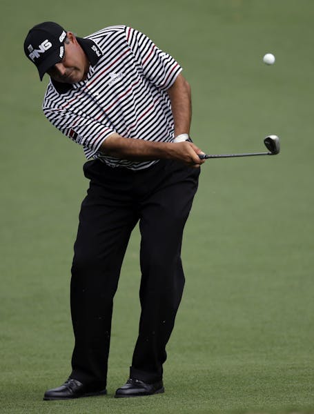 Angel Cabrera, of Argentina, chips to the second green during the second round of the Masters golf tournament Friday, April 12, 2013, in Augusta, Ga. 
