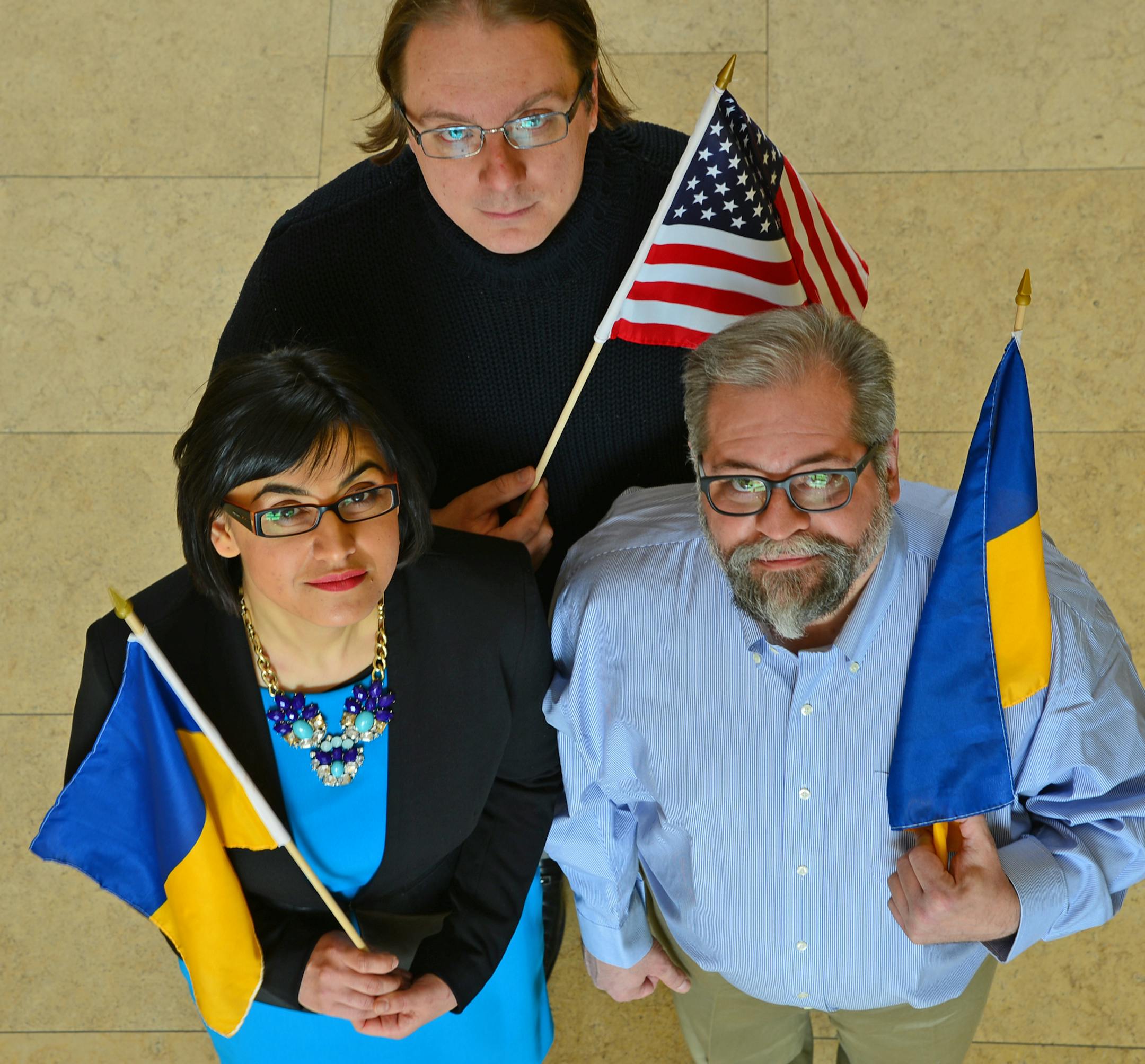 Local Ukrainian's Ophelia Karamushko, Stefan Iwaskewycz and Walter Anastazievsky held an American and Ukranian flags for this portrait. ] Local Ukrainian-Americans reflect on the events in Ukraine and call attention to the new civic Ukrainian identity that is replacing the old ethnic divides. Richard.Sennott@startribune.com Richard Sennott/Star Tribune Minneapolis , Minn.Wednesday 3/26/2014) ** (cq)