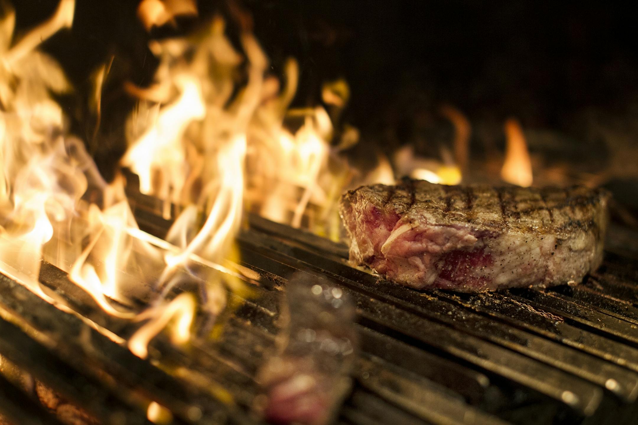 The wood fire grill at Burch Steakhouse and Pizza Bar December 13, 2013.
