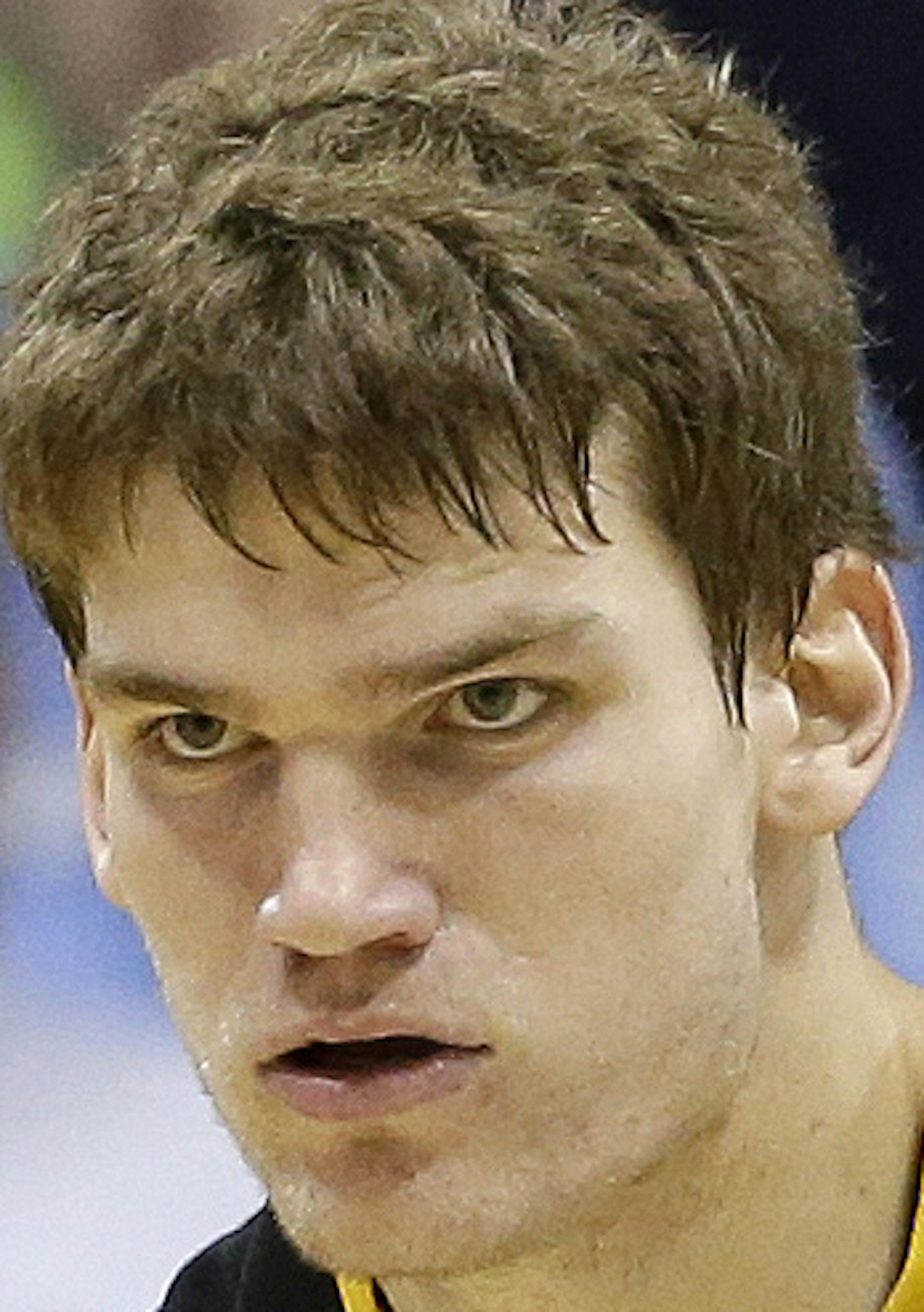 Iowa's Adam Woodbury (34) reacts following a basket against North Carolina during the second half of an NCAA college basketball game in Chapel Hill, N.C., Wednesday, Dec. 3, 2014. Iowa won 60-55. (AP Photo/Gerry Broome) ORG XMIT: NCGB116