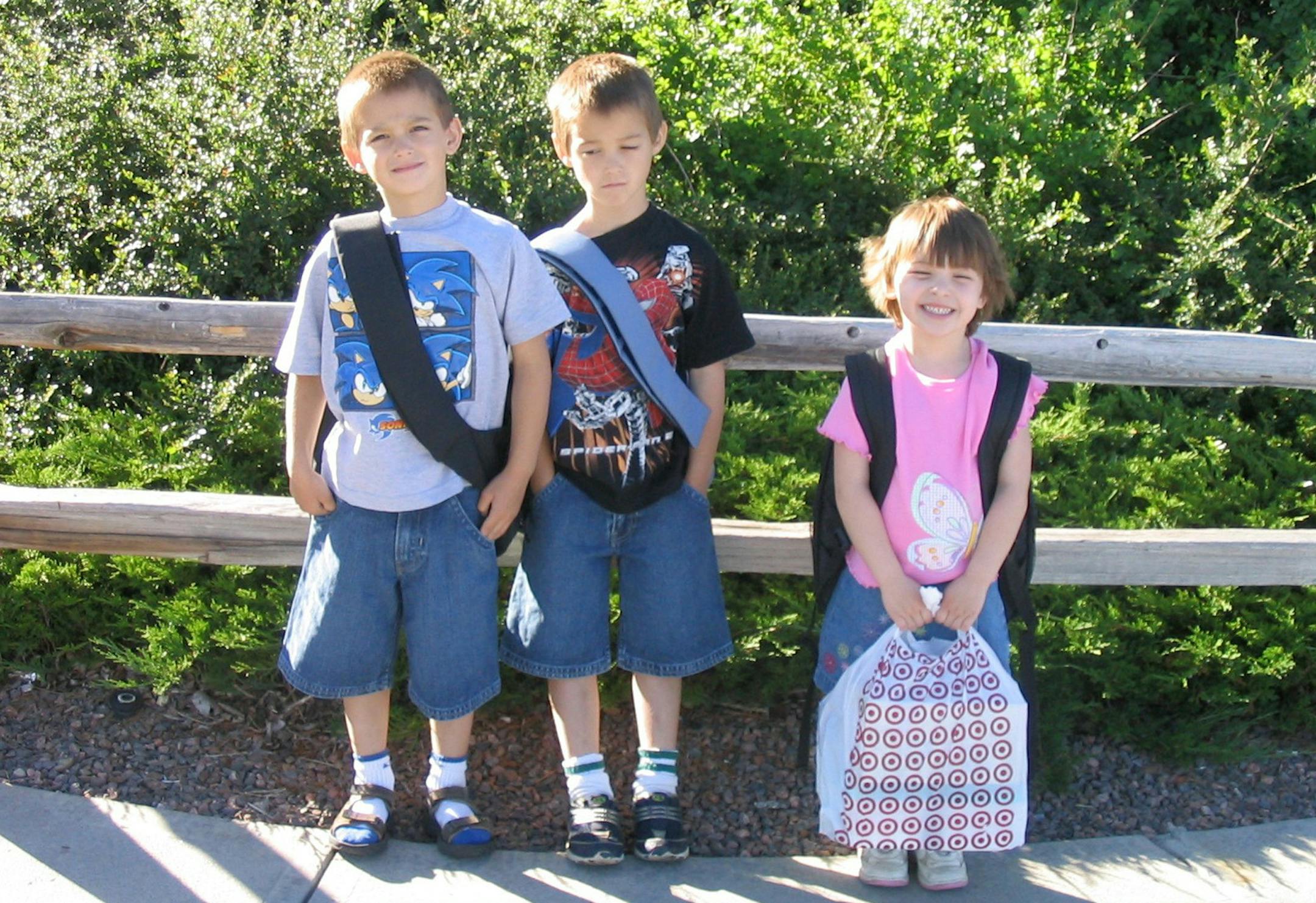 Pam Stegora Axberg, New Brighton
When in Denver, in year-round school, the kids started in July! Timothy and Anthony (twins) didn’t look as excited as their younger sister who was starting kindergarten. All the new stuff didn’t fit in their backpacks. Rolling Hills Elementary School. July 2004 Timothy, Anthony, and Elizabeth Axberg