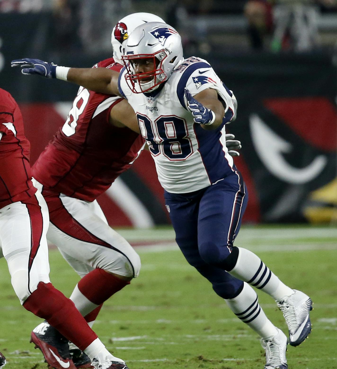 Arizona Cardinals quarterback Carson Palmer (3) is sacked by New England Patriots defensive end Trey Flowers (98) during an NFL football game, Sunday, Sept. 11, 2016, in Glendale, Ariz. (AP Photo/Ross D. Franklin) ORG XMIT: AZMY132