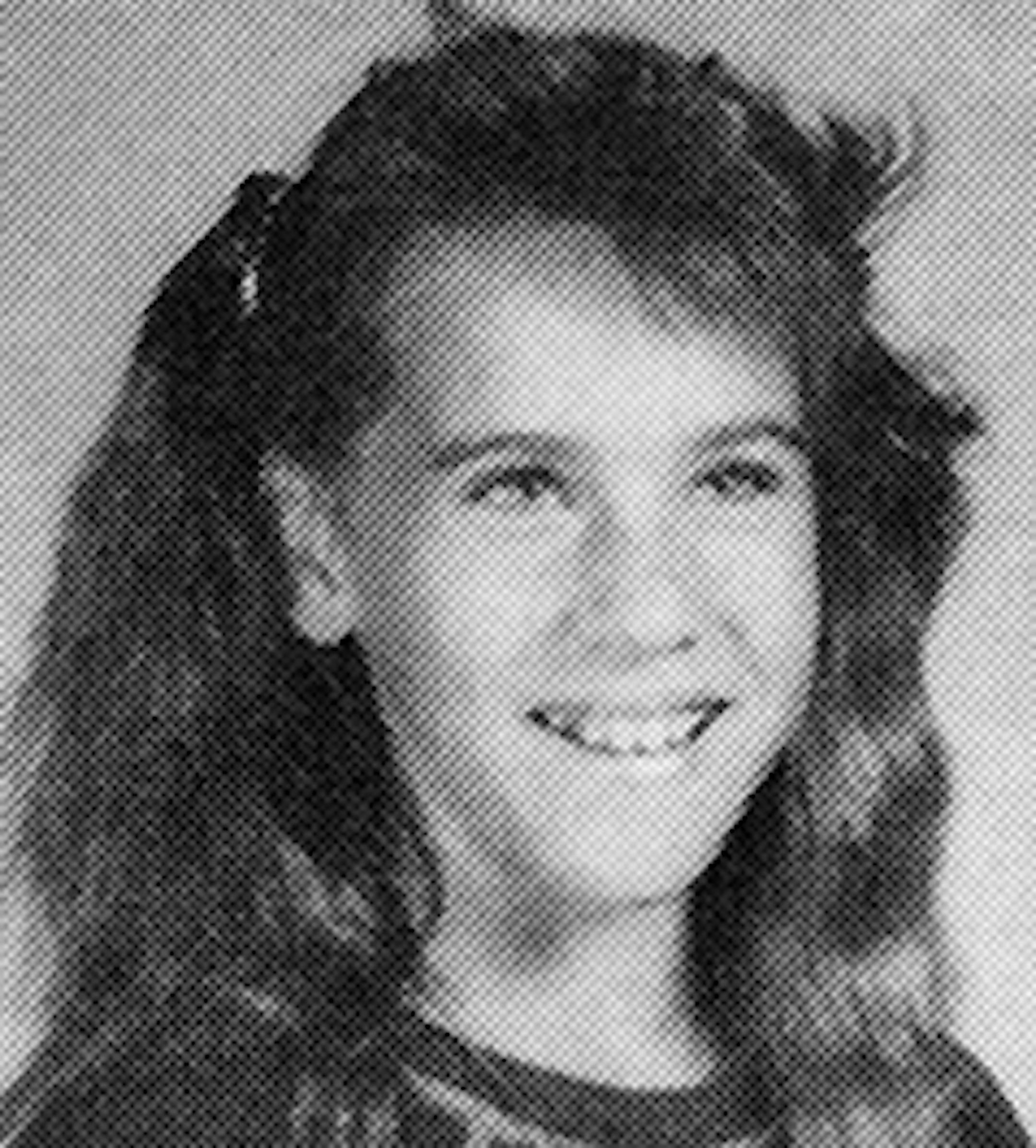 Amy Sue Pagnac's yearbook photo from seventh grade at Osseo Junior High in1988-1989.