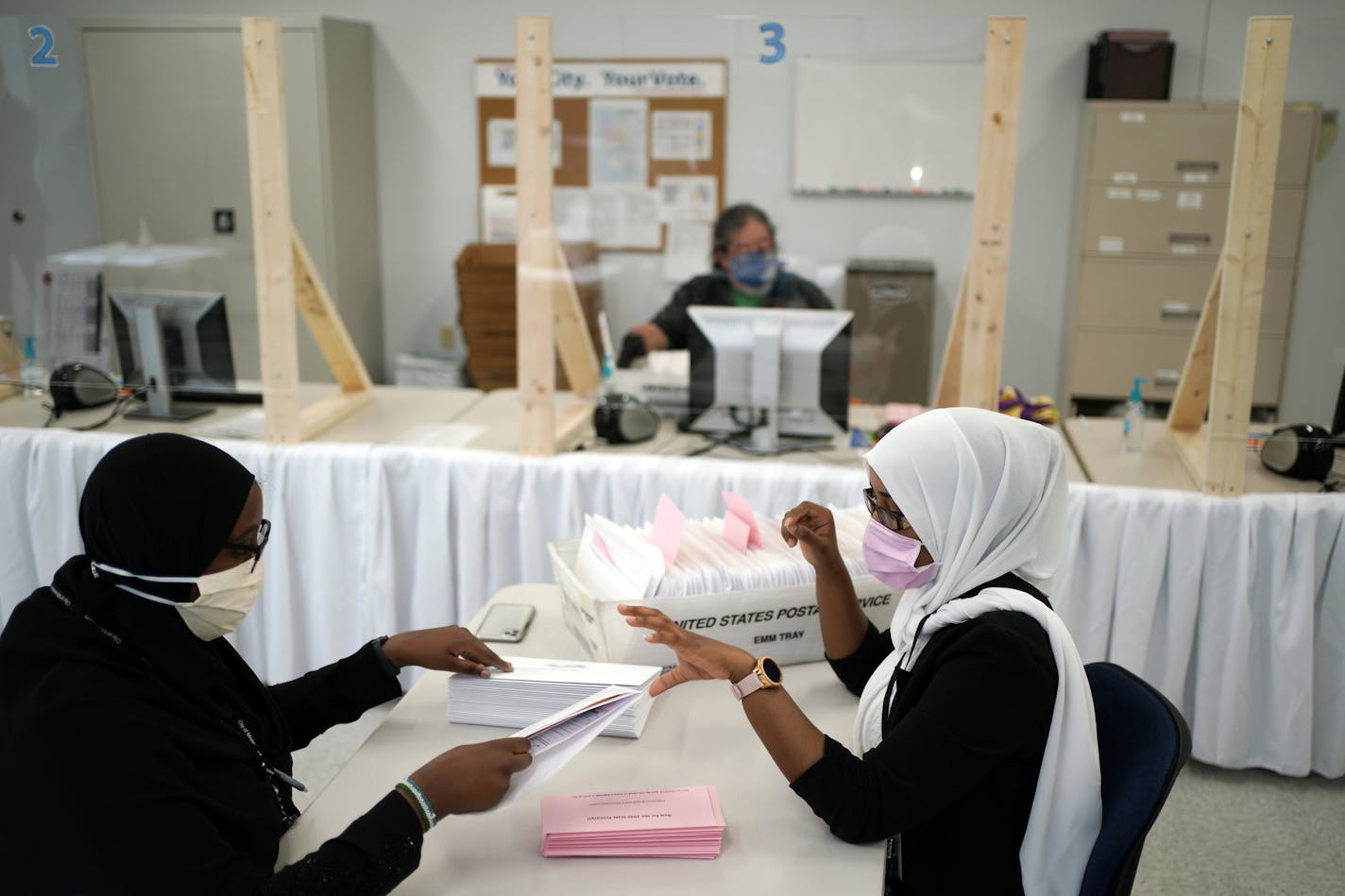 Grace Wachlarowicz, Minneapolis Director of Elections & Voter Services, offered the media a look at its new early voting center. Here, workers stuff some of the 24,000 envelopes for those requesting absentee ballots. brian.peterson@startribune.com Minneapolis, MN Thursday, June 25, 2020