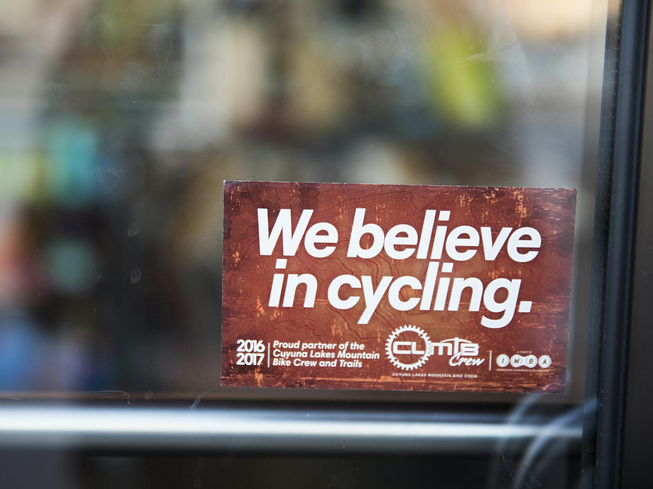 A sign on the door of Red Raven, a cafe and bike shop in Crosby. ] LEILA NAVIDI &#xef; leila.navidi@startribune.com BACKGROUND INFORMATION: People ride the mountain bike trails at Cuyuna Country State Recreation Area near the communities of Crosby and Ironton on Friday, October 13, 2017. A popular mountain bike trail carved five years ago into a derelict ore mine in northern Minnesota drew tens of thousands of tourists this summer, pumping up the local economy in Crosby-Ironton as cyclists ridin