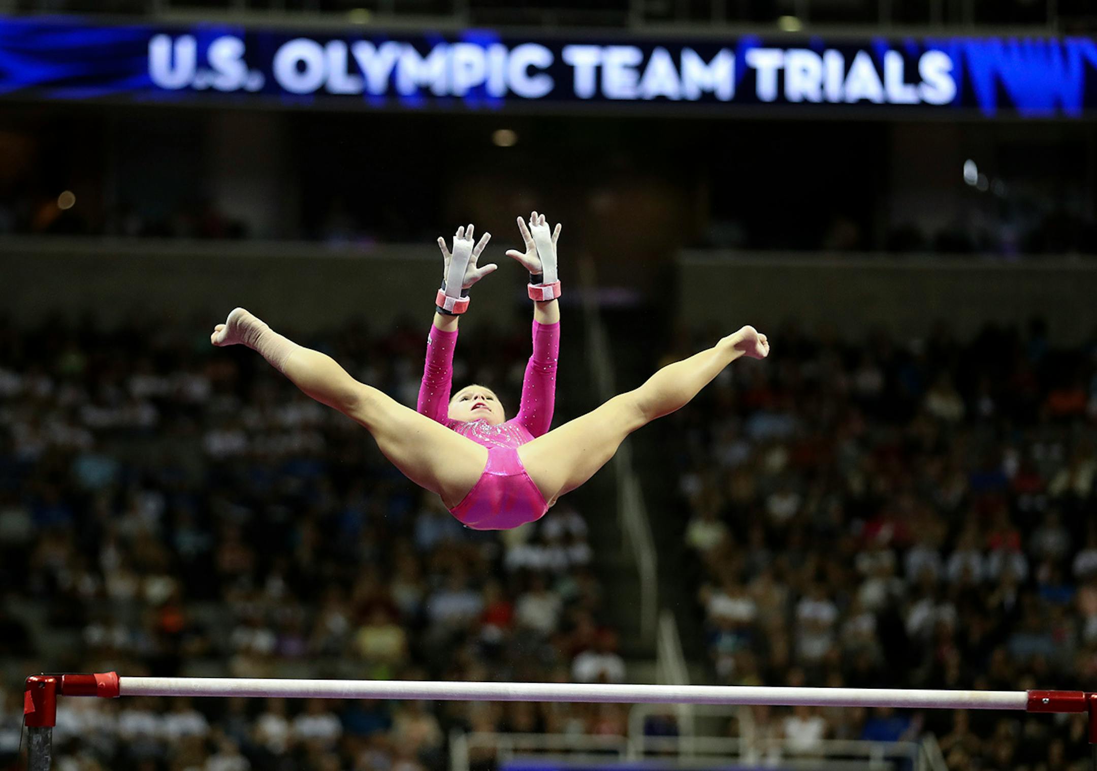 Day 1 - Regan Smith flips to the high bar during her uneven bar routine Friday night.