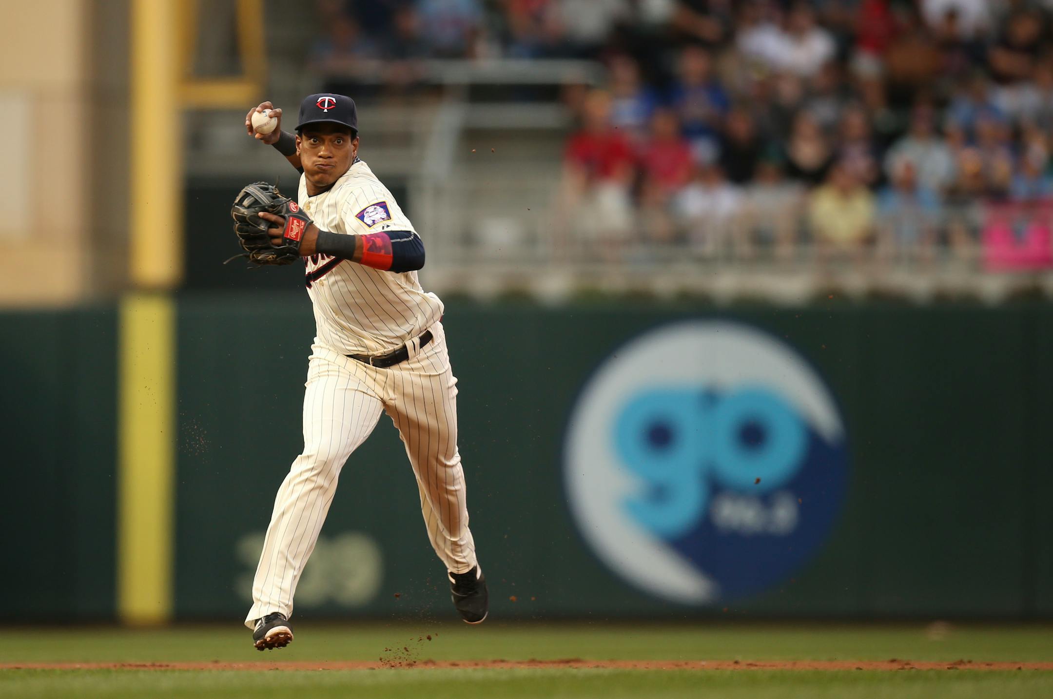 Twins shortstop Jorge Polanco threw to first for the out after fielding a grounder hit by the Royals Omar Infante in the second inning.