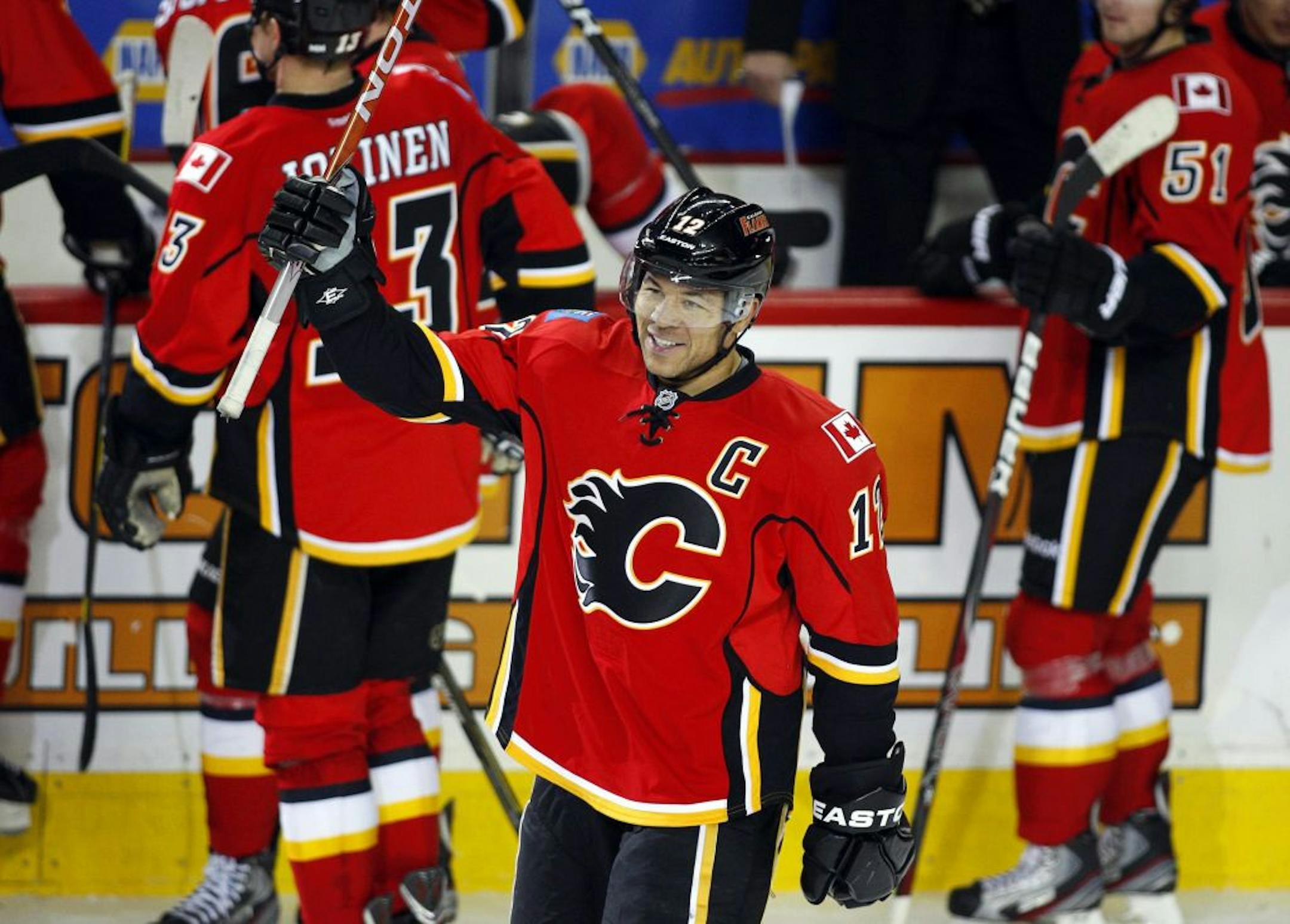 Calgary Flames' Jarome Iginla celebrates his 500th carrier goal during third NHL hockey action against the Minnesota Wild in Calgary, Alberta, Saturday, Jan. 7, 2012.