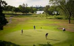 Golfers play at the Hiawatha Golf Course in Minneapolis in summer 2021.