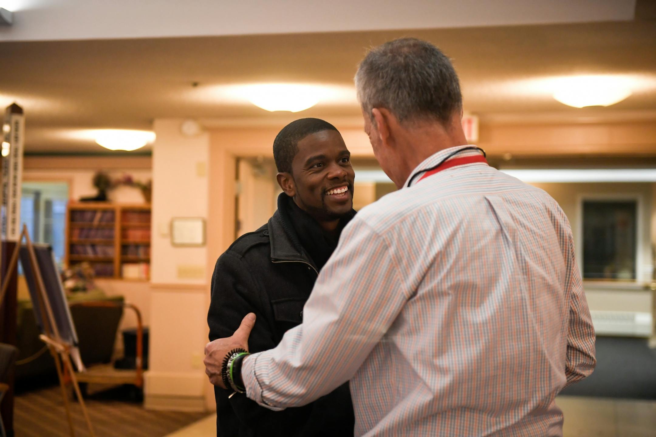 St. Paul mayoral candidate Melvin Carter was greeted by election judges upon his arrival at the polling station in Ravoux Hi-Rise in St. Paul early Tuesday morning.
