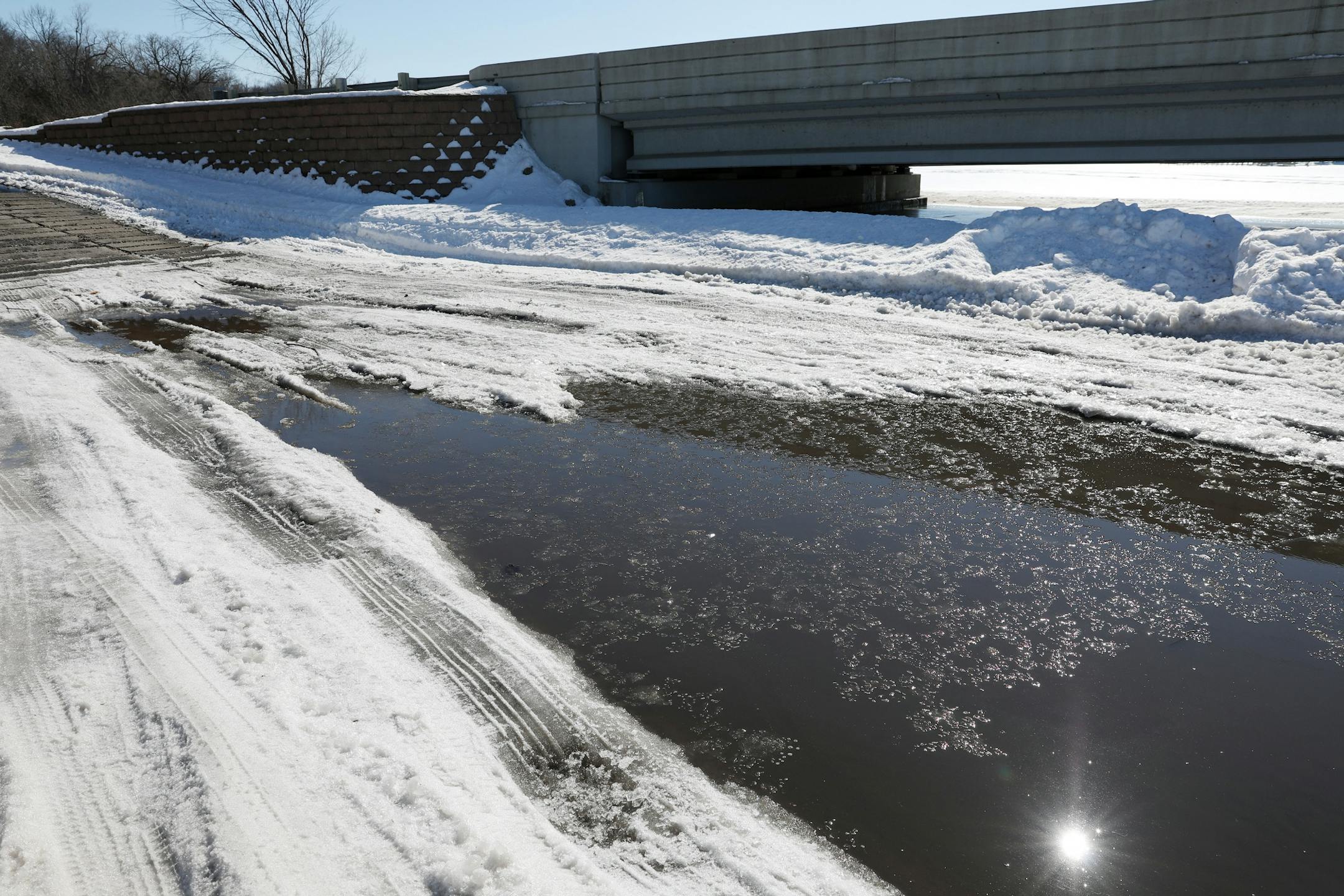 Salt from road runoff and brought in on vehicle tires has caused a more rapid deterioration in the ice near the boat launch ramp at Lake Minnetonka.