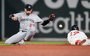 Twins second baseman Edouard Julien (47) loses control of the ball on a stolen base by Boston's David Hamilton during the fifth inning Friday night at