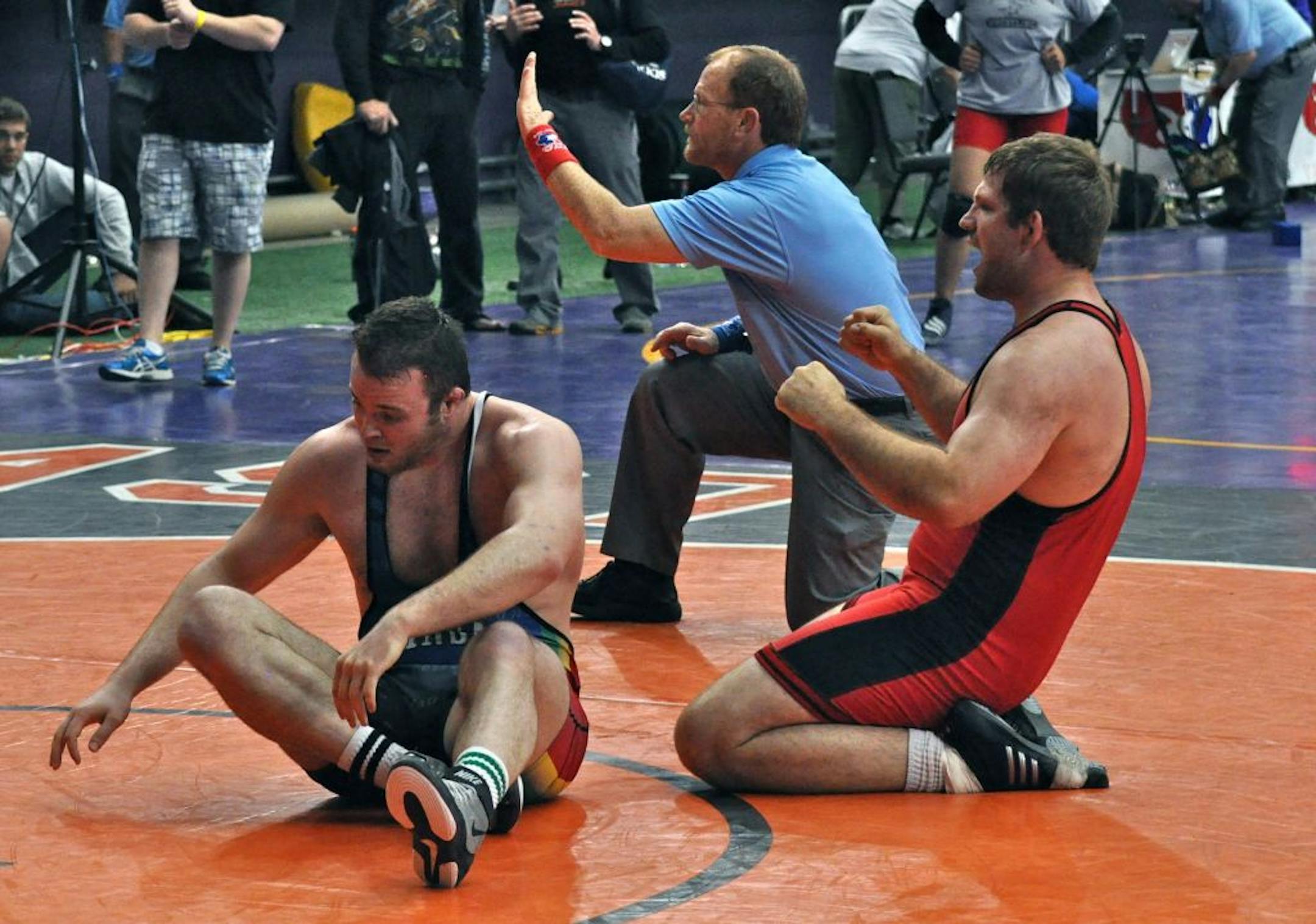 Nick Severson (right) of Pine Island, Minn., finished second in the final U.S. Olympic wrestling qualifier March 30 to earn a spot in the trials.