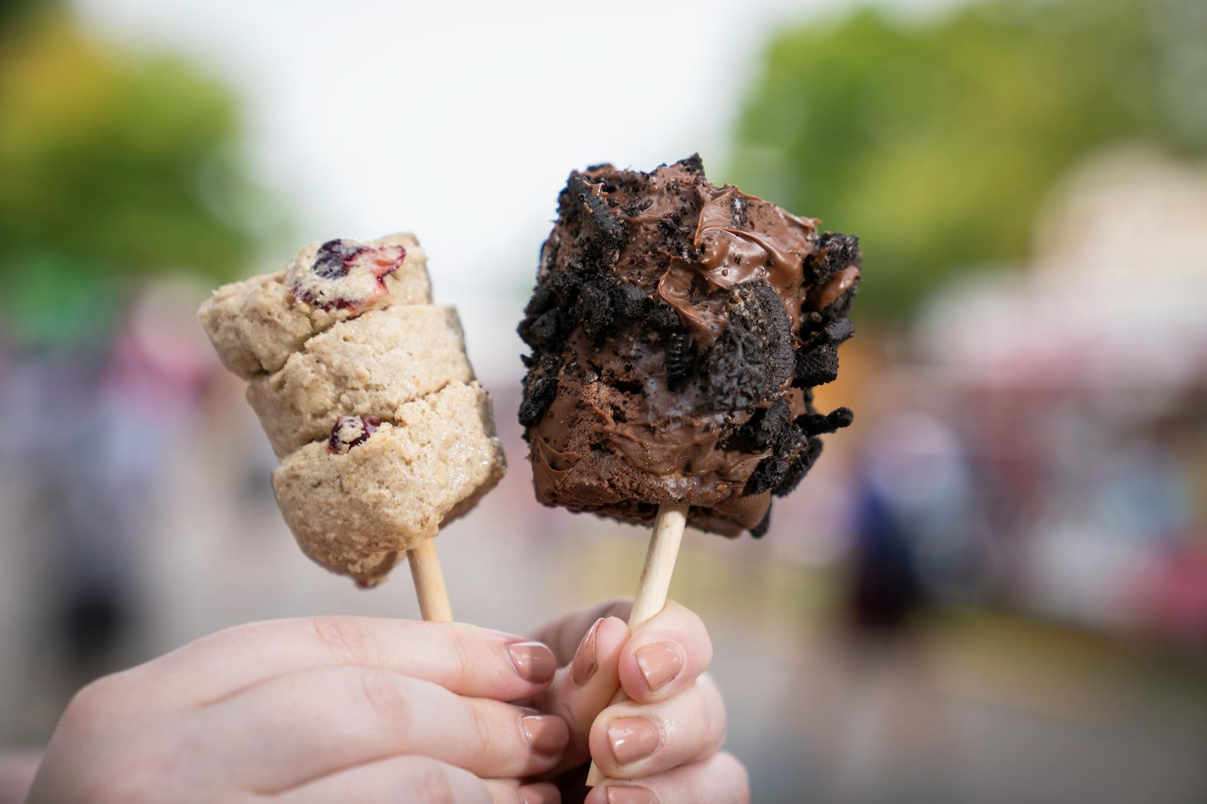 White Chocolate Cranberry, left, and Oreo Classic from Kora’s Cookie Dough The new foods of the 2023 Minnesota State Fair photographed on the first day of the fair in Falcon Heights, Minn. on Tuesday, Aug. 8, 2023. ] LEILA NAVIDI • leila.navidi@startribune.com