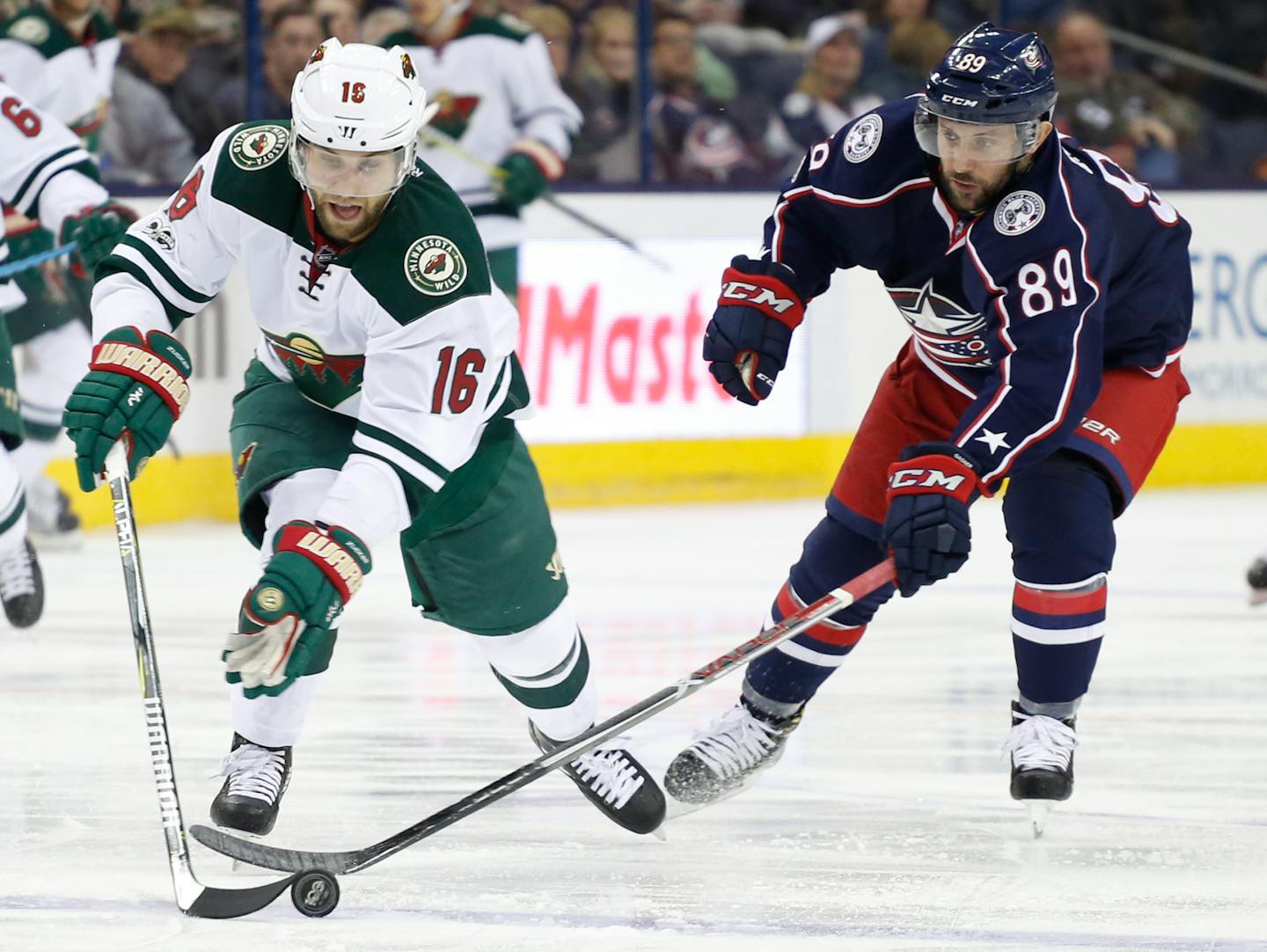 Minnesota Wild's Jason Zucker, left.