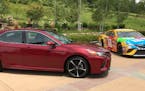 Visual similarities between the 2018 Toyota Camry street car and NASCAR racer loom large in Toyota's pitch for the car's performance. (Mark Phelan/Det