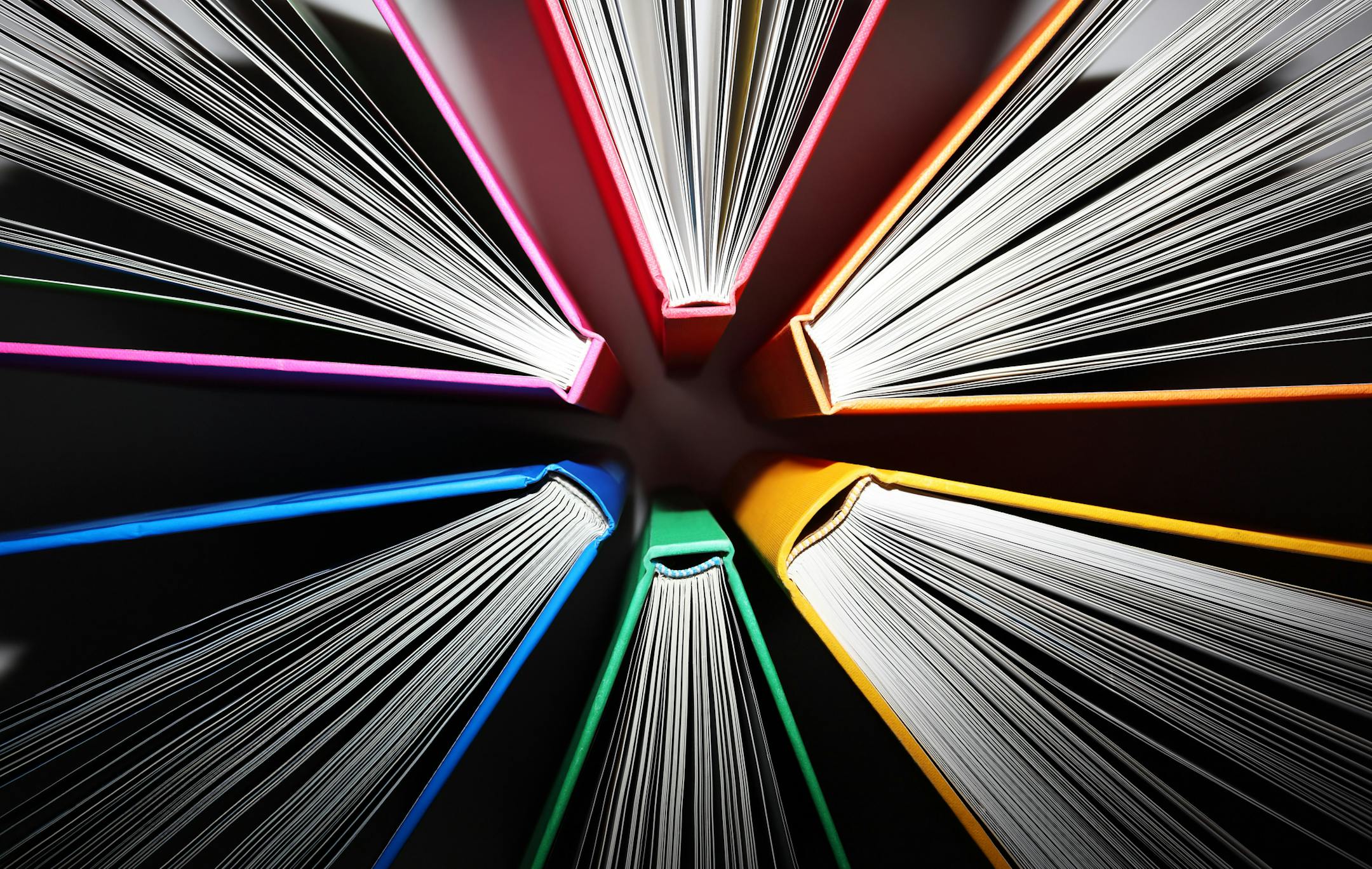 Fanned out colorful books forming an abstract pattern of explosion. ORG XMIT: MIN1705241657240576