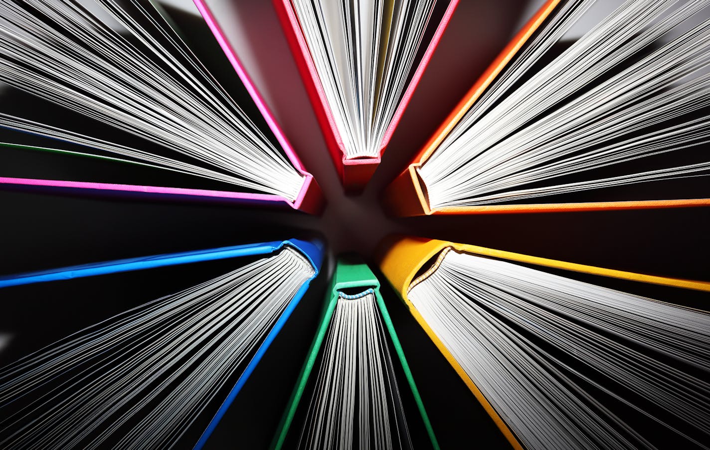 Fanned out colorful books forming an abstract pattern of explosion. ORG XMIT: MIN1705241657240576