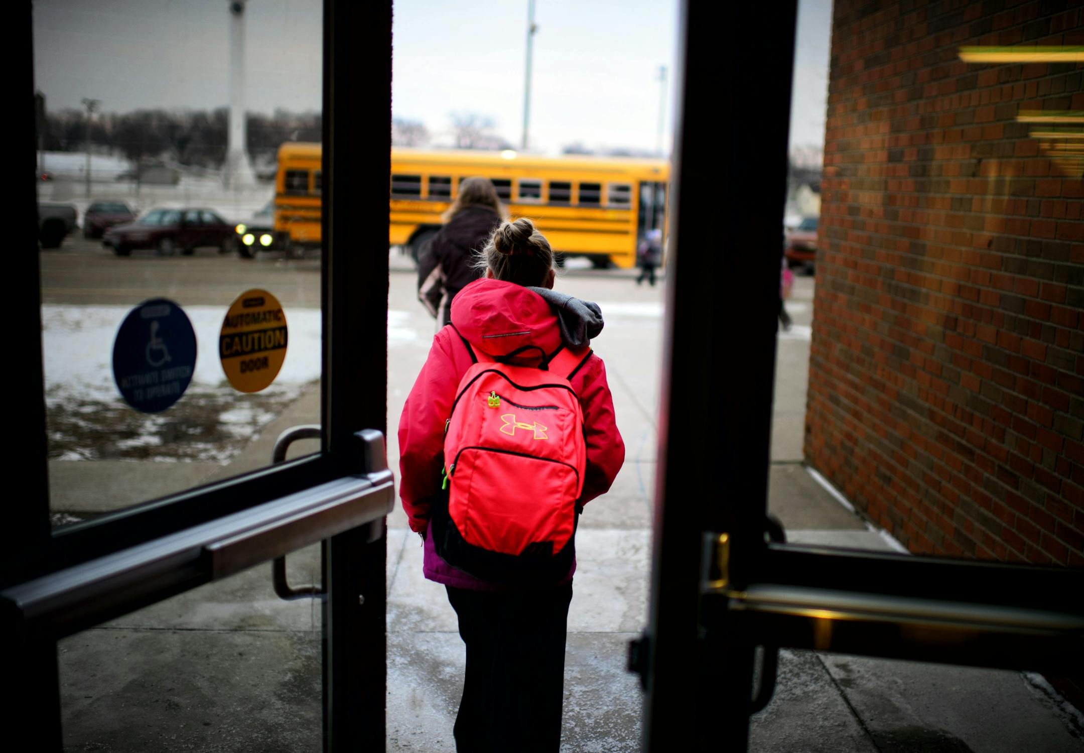 MACCRAY students head to the busses at four o'clock at the end of the day. Four day weeks have days that start 30 minutes earlier and end 30 minutes later than 5-day a week students. The high school is a hub for busses from the district's two elementary schools to make bus routes more efficient throughout the district. ] GLEN STUBBE * gstubbe@startribune.com Wednesday, December 17, 2014 A fight is brewing here in this small pocket of southwestern Minnesota between a handful of rural school distr